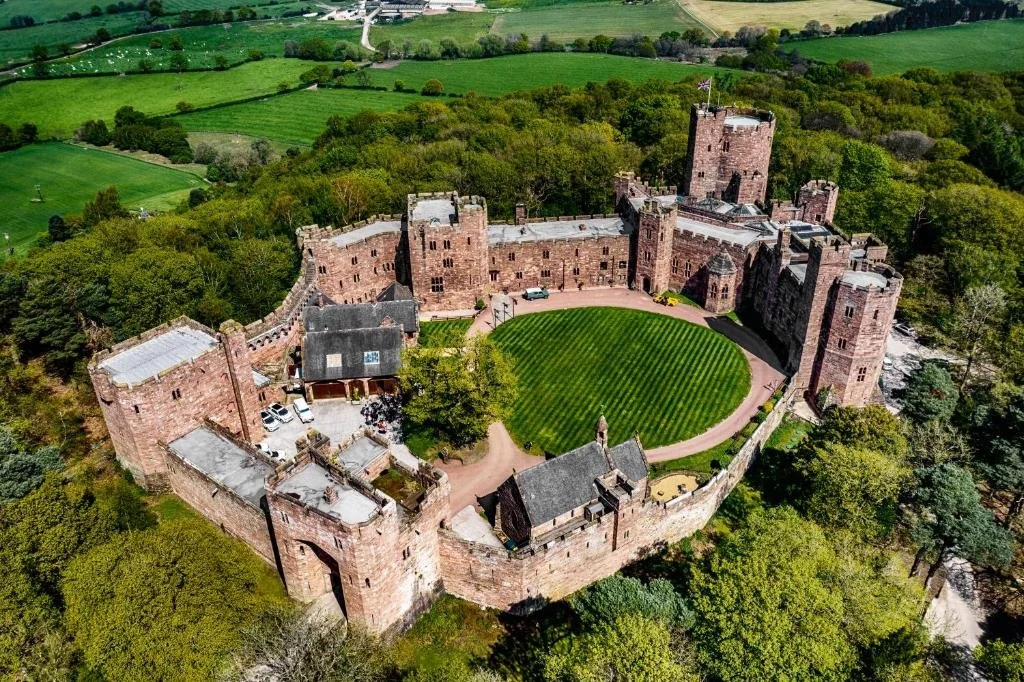 Cheshire Wedding Videographer, drone shot of Peckforton Castle on a sunny day
