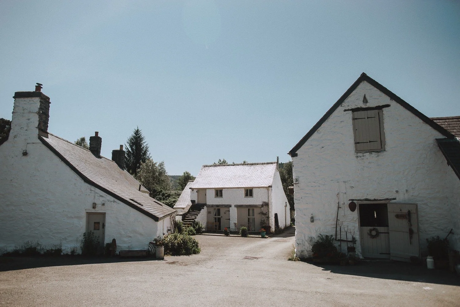 barn wedding venue North Wales, outside shot of the three barns on a sunny clear day at Hafod Farm