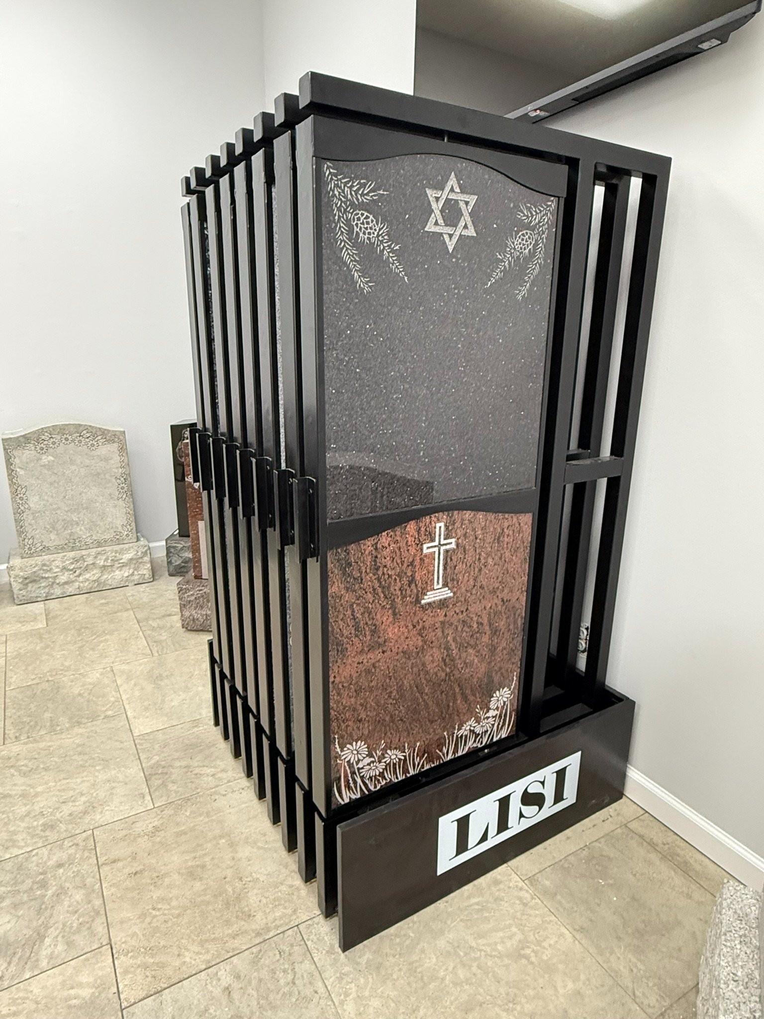 The Display Stand, showcasing 32 granite colors and monument designs in a 3-0 x 3-0 footprint
