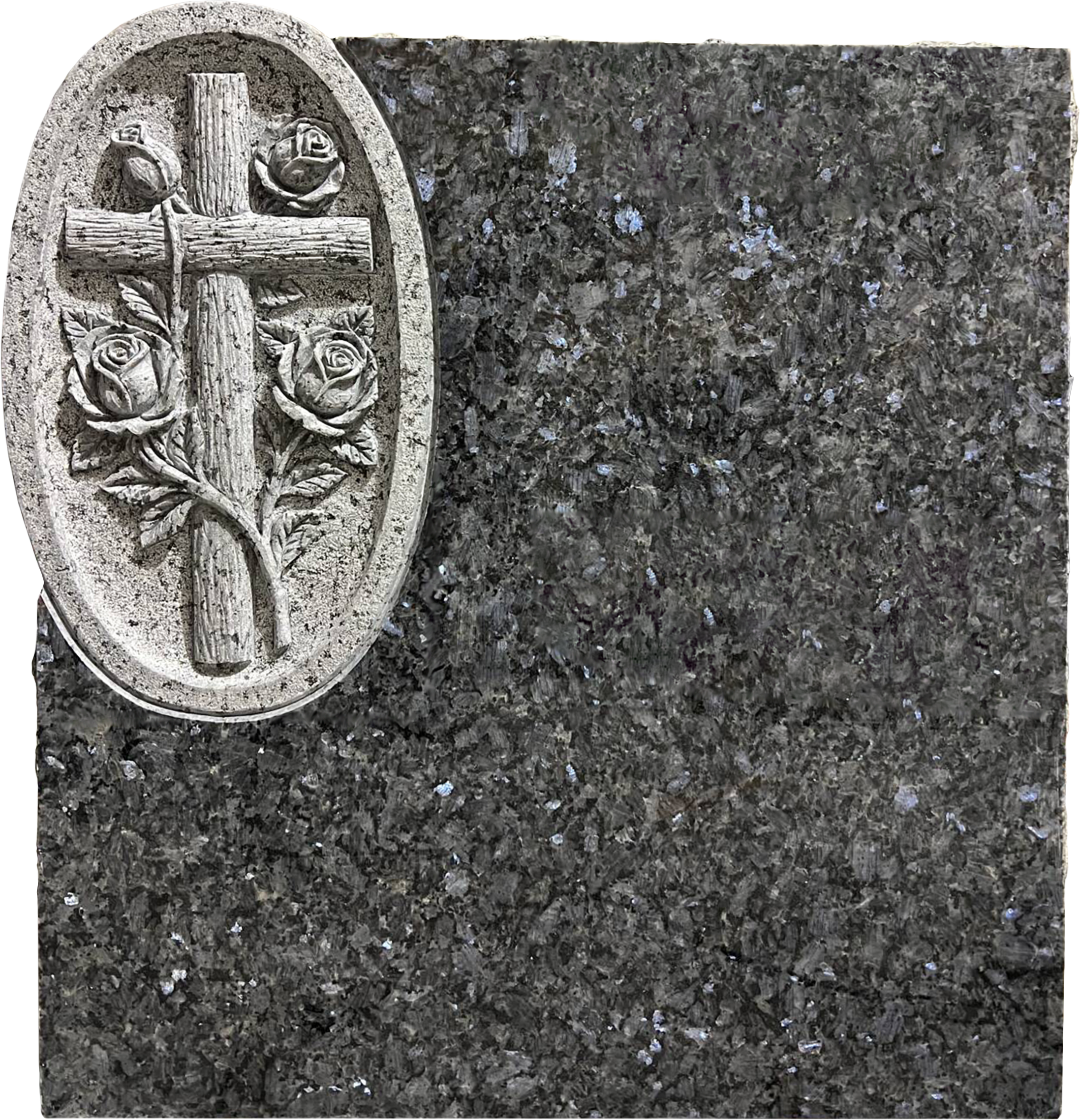 Close-up of a granite monument with a carved wooden cross surrounded by roses on a speckled black and gray stone surface.