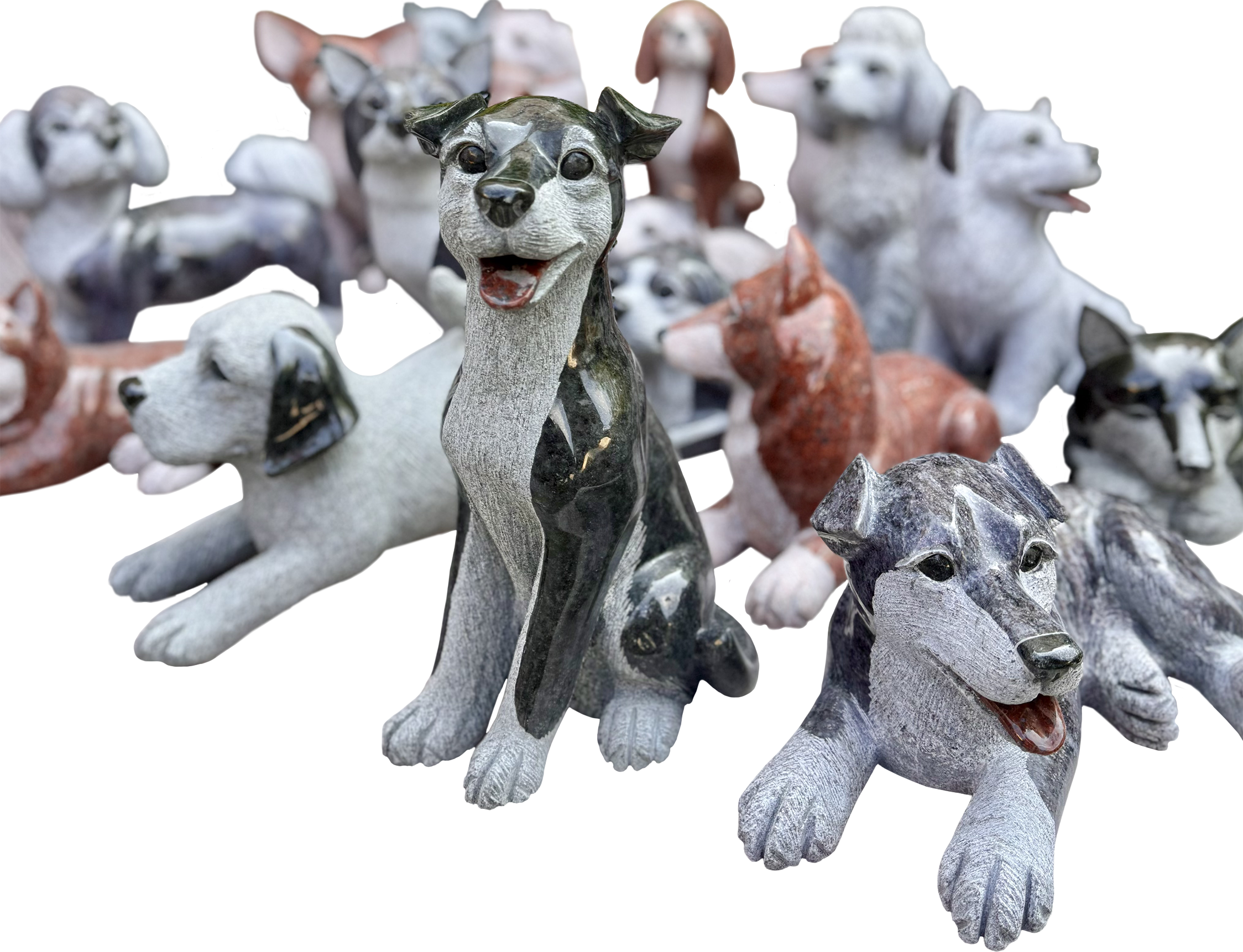 Collection of stone dog sculptures with various breeds and positions.