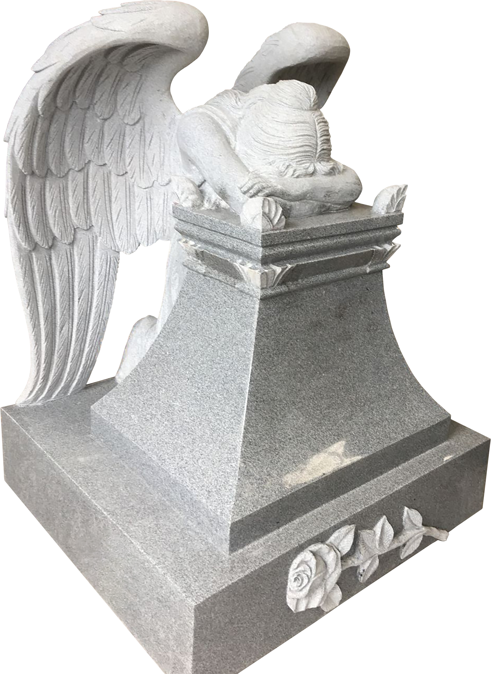 A white marble tombstone with a carved angel with wings leaning over, resting its head and arms on the top of the tomb. The base of the monument has carved roses and a decorative border.
