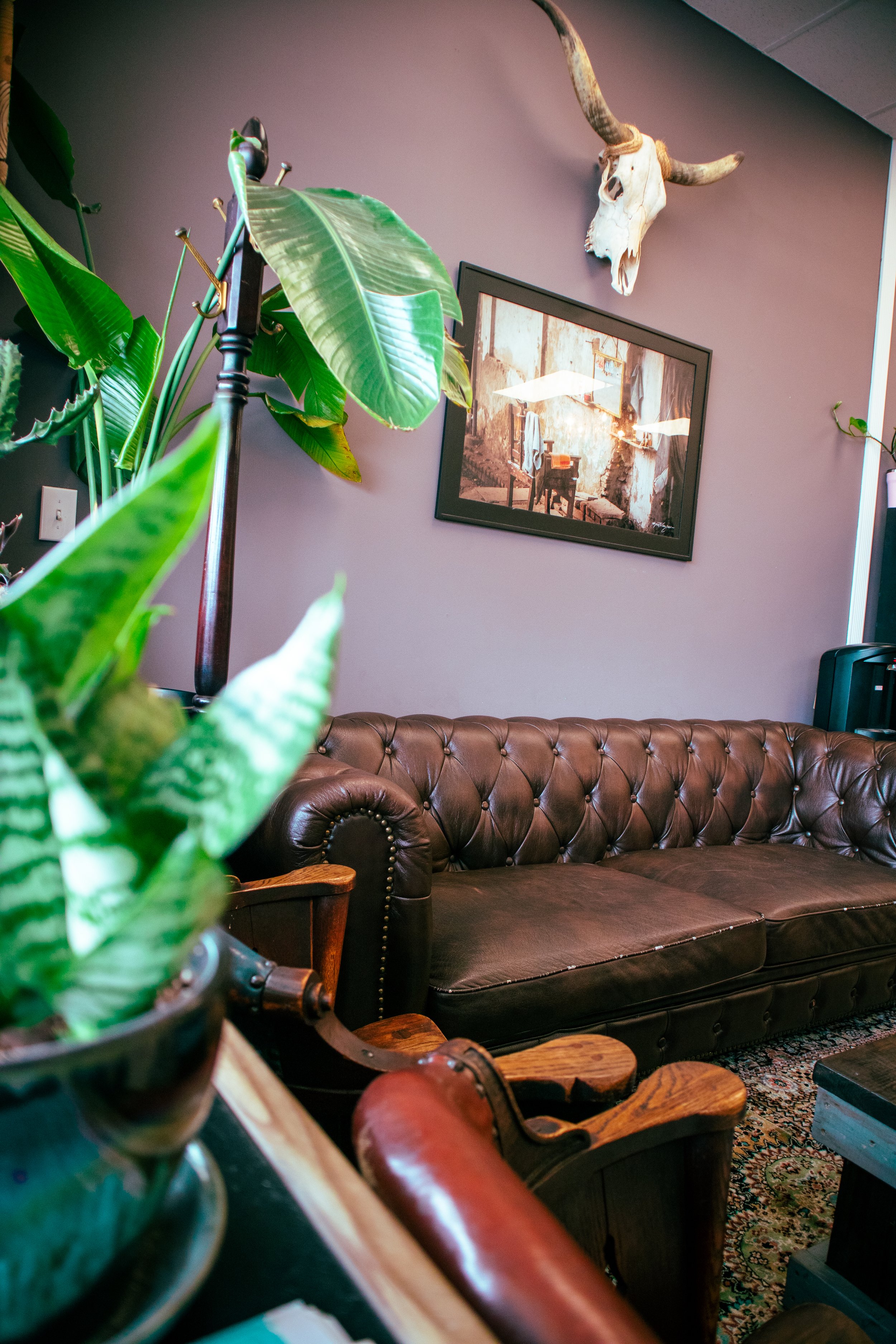  Comfy sofa in waiting room at Tame the Mane Barbershop 