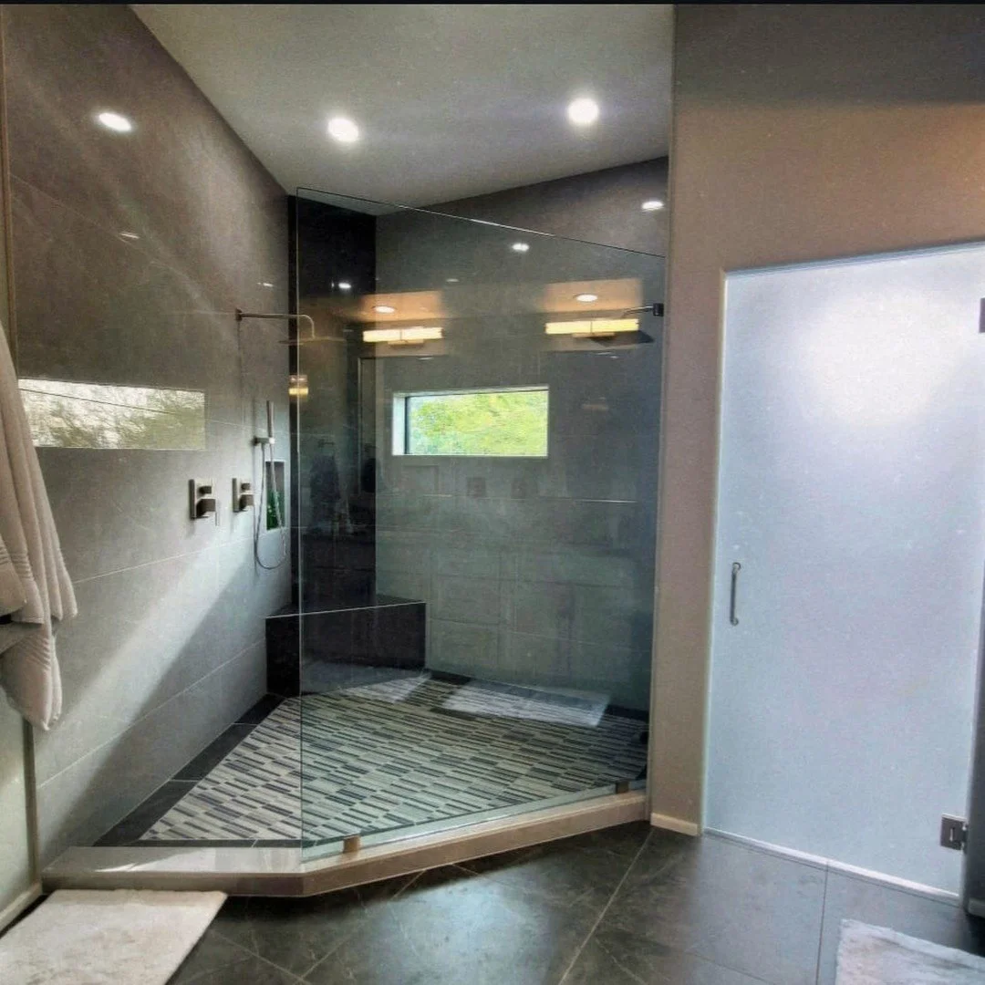 A closer look at this breathtaking transformation of one of our recent bathroom remodels. This master bathroom had us working with challenging angles and utilization of space, but we made it work. We made a 'feature' wall by incorporating the black t