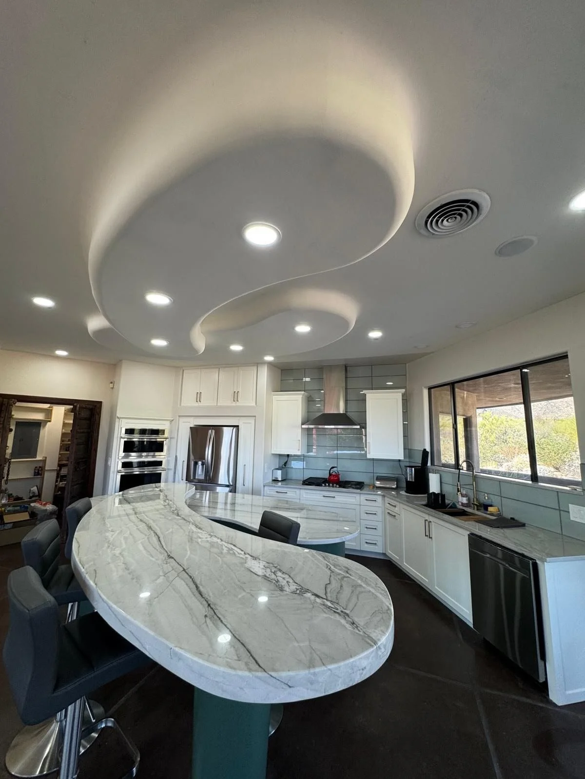 Another Before and After transformation! Swipe to the end to see how this kitchen looked before! Our customer wanted to keep the same layout and unique shape of his island/bar top. We love the architecture of this home and want to preserve how the ce