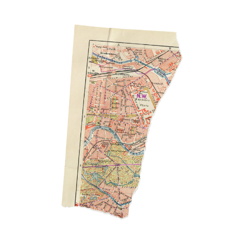 A torn piece of a city map showing streets and neighborhoods.