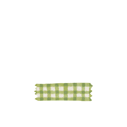A black cat with yellow eyes sitting next to a piece of green and white checked fabric.