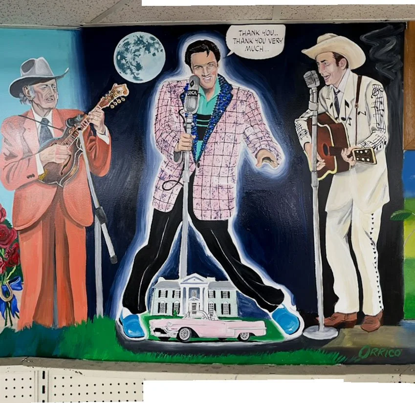 Hank Williams on left, Elvis center above pink cadillac and Graceland, Johnny Cash on right
