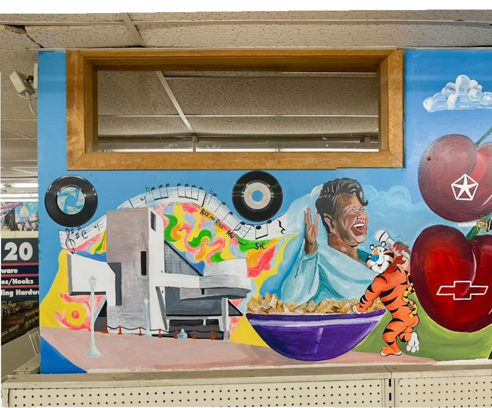 Rock and Roll Hall of Fame under two records, bowl of Kellog's cereal to its right with Tony the Tiger standing next to it, Aretha Franklin in background, cherries with Chevrolet and Chrysler logos on right side