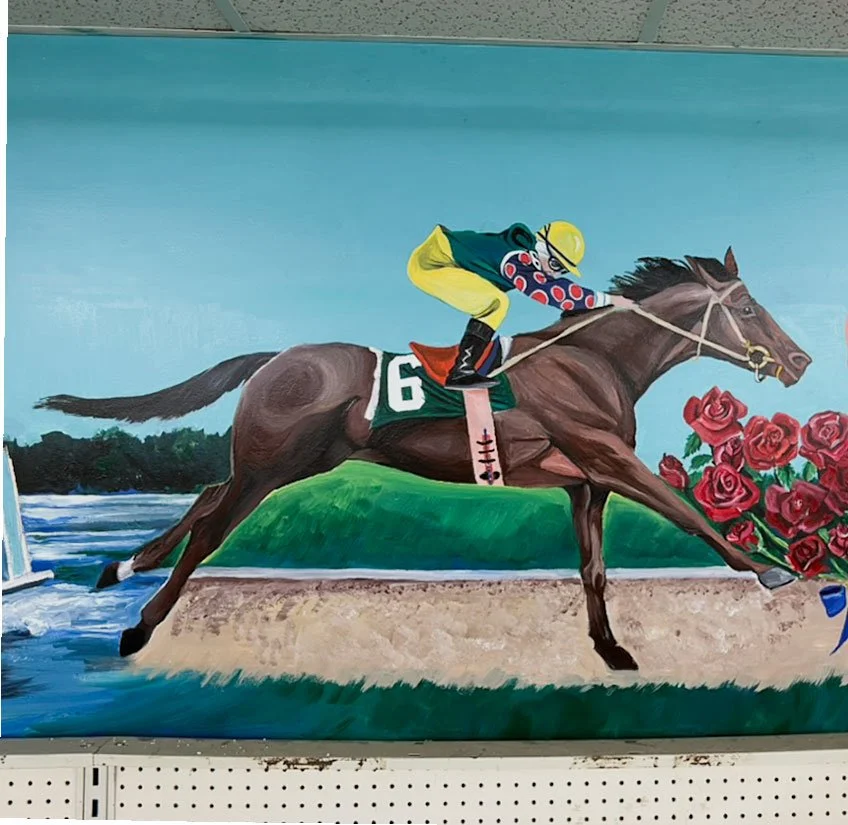 Seabiscuit racing down track, roses on right side