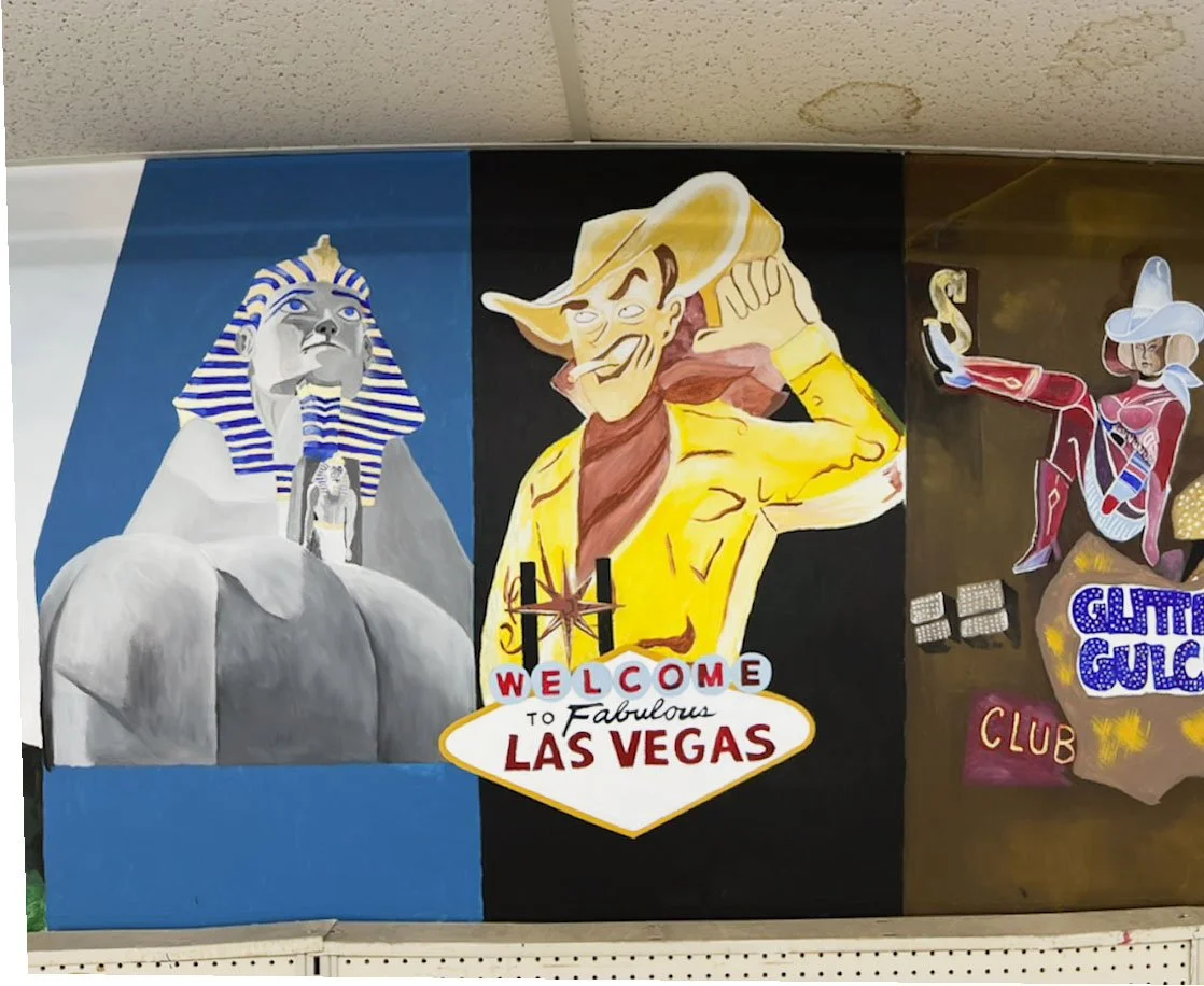 Luxor sphinx statue on left, Vegas Vic behind Welcome to Las Vegas sign in center, Glitter Gulch sign on right