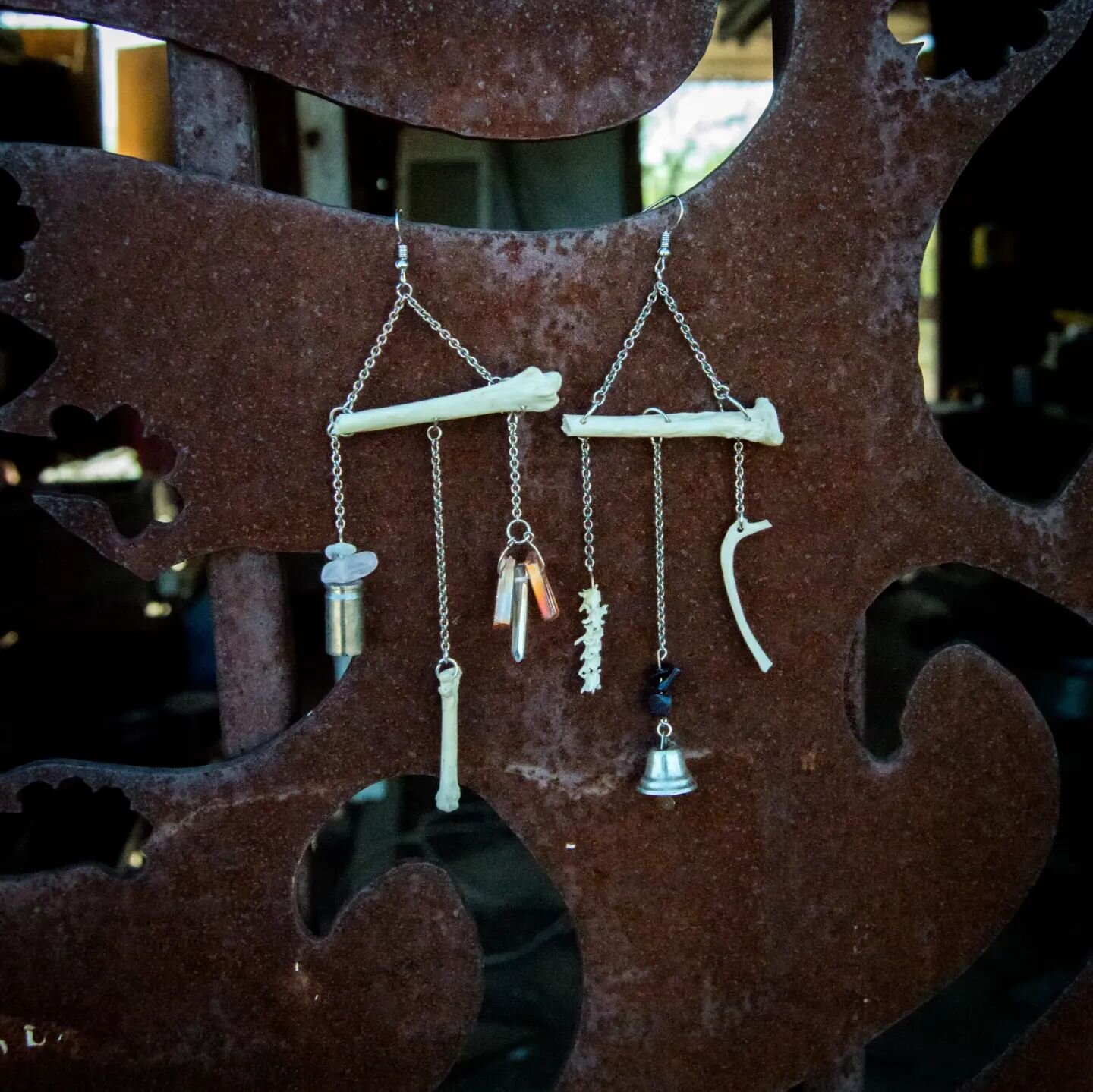 Radius Jangle - Bone Chime Earrings ✨💎

Made with love for the bold babes who aren&rsquo;t afraid to jingle, and jangle, with every step.

Adorned with a raccoon metacarpal &amp; radius bones, snake vertebrae, clear quartz, orange aura quartz, purpl