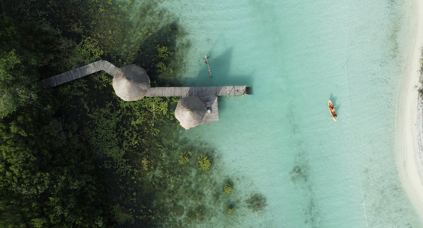 Aerial view of Bacalar lagoon with dock and kayak