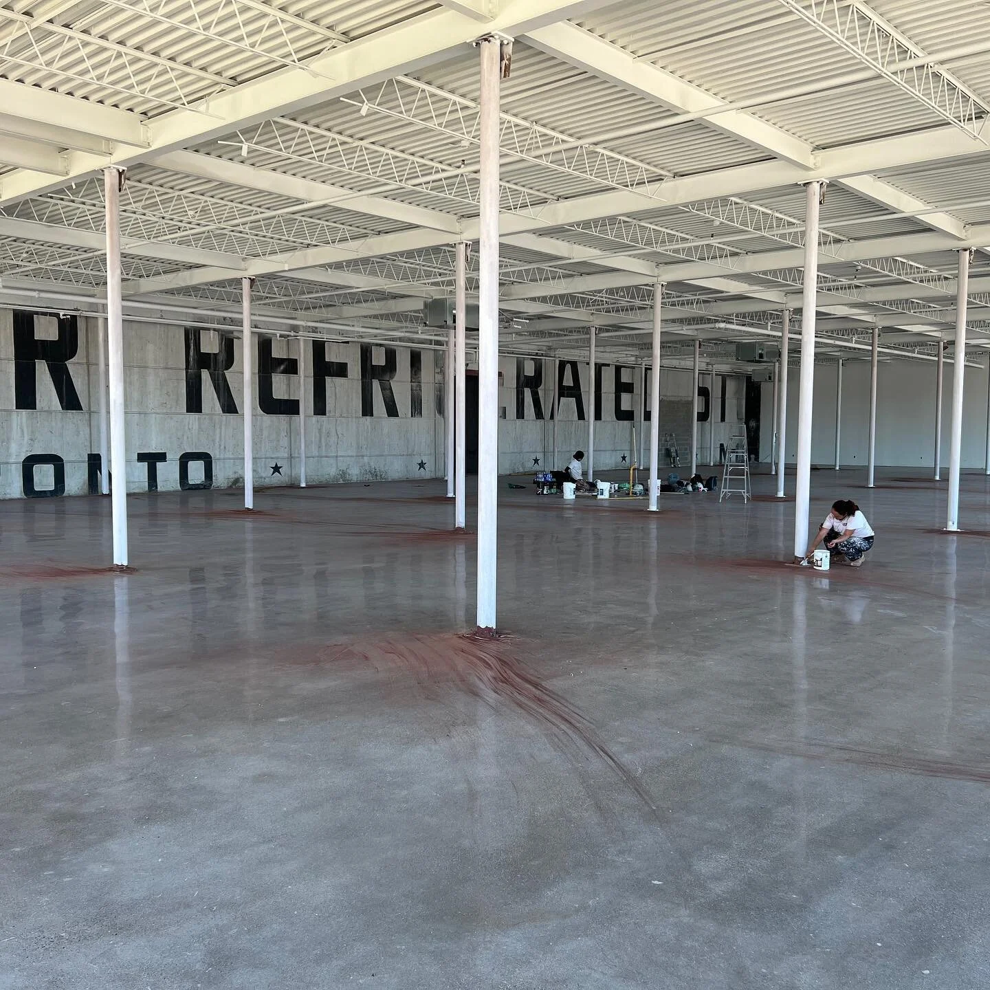 10,000 sq ft of commercial space. Our client wanted to brighten up the space. Painted the metal deck and posts white. Swipe for the before(s)