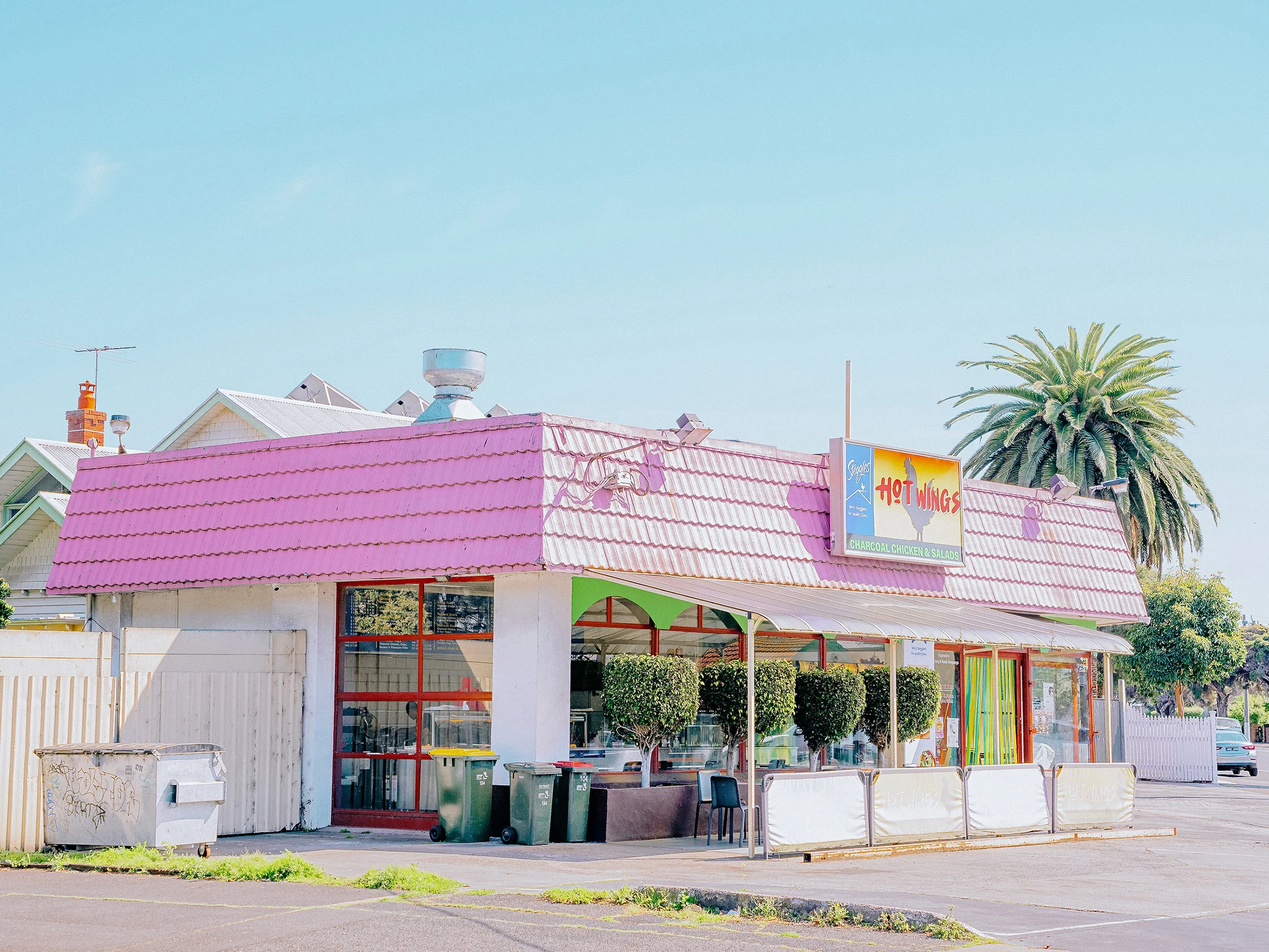 The Hot Wings Charcoal Chicken Building in Williamstown, with the distinctive pink roof.