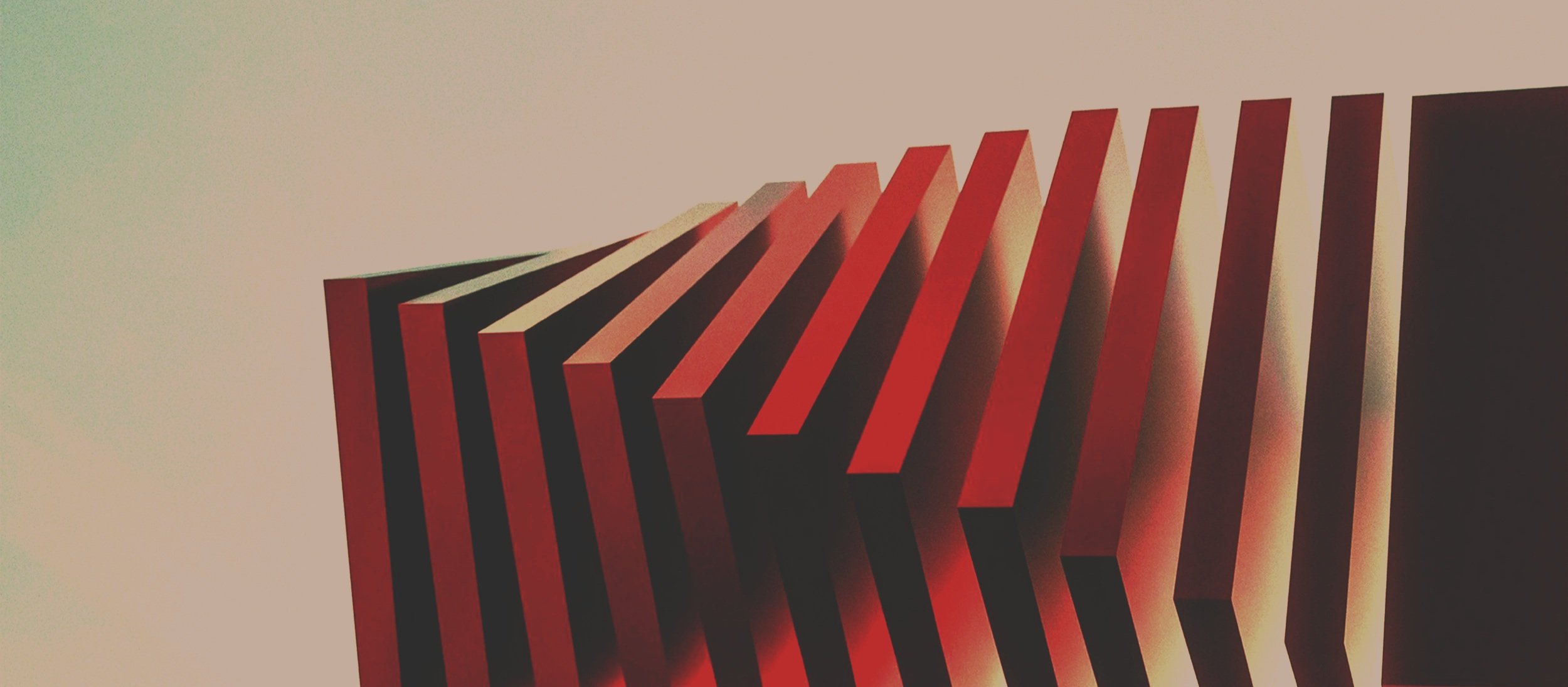 Dominos falling in sequence — navigating cascading  organizational change through AI executive coaching