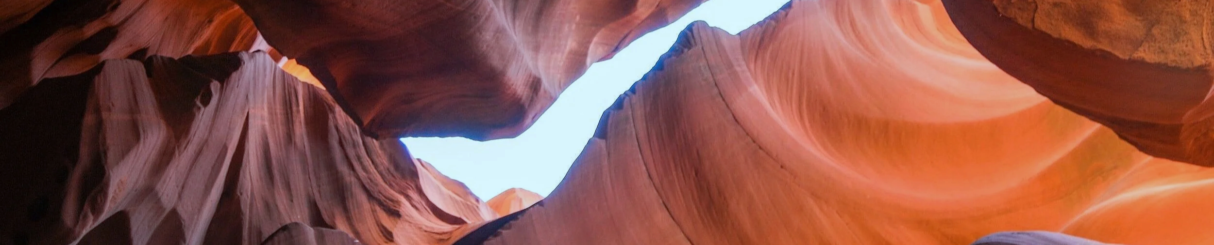 Light breaking through canyon walls — finding clarity  and breakthrough in leadership and career development
