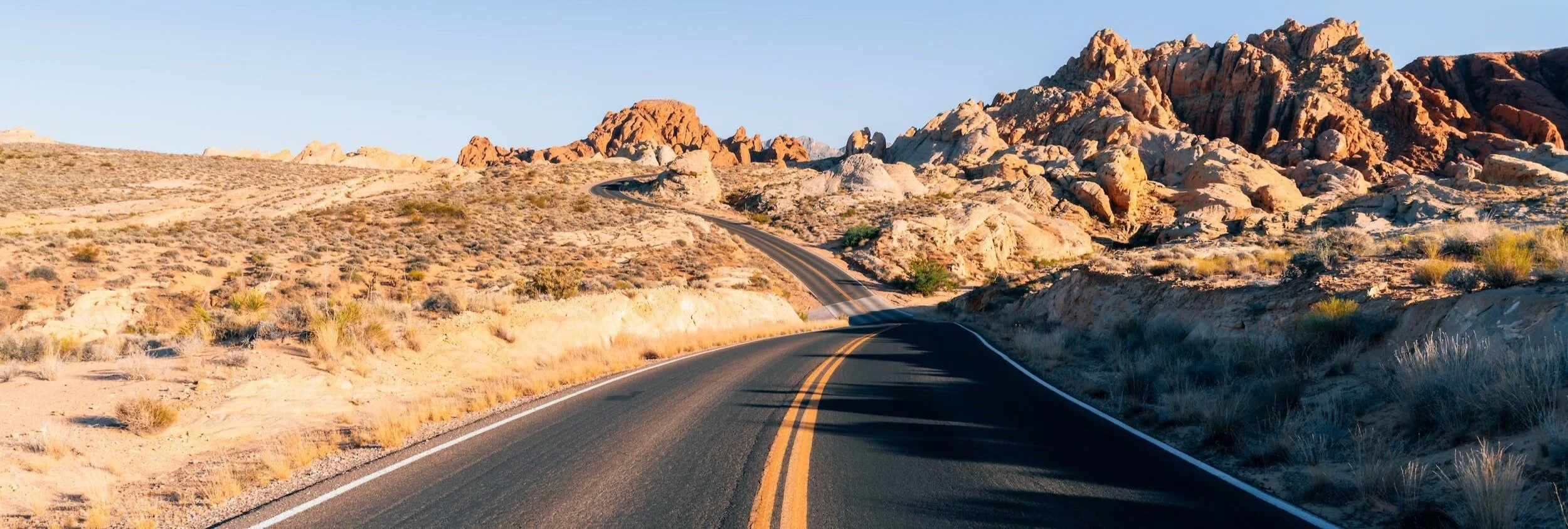 Open road through desert landscape — career coaching  and leadership development for professionals navigating change
