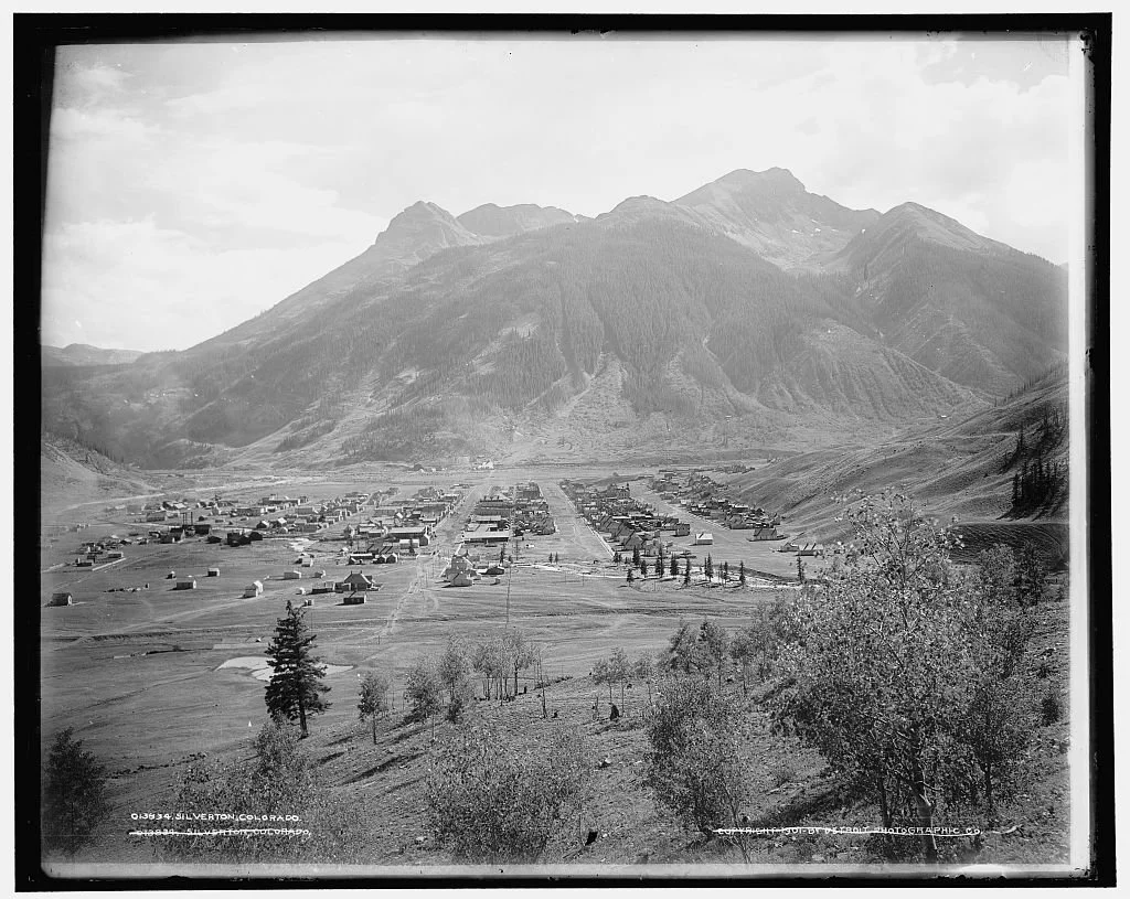 Historic photograph of Silverton, Colorado, surrounded by the San Juan Mountains during the mining era.