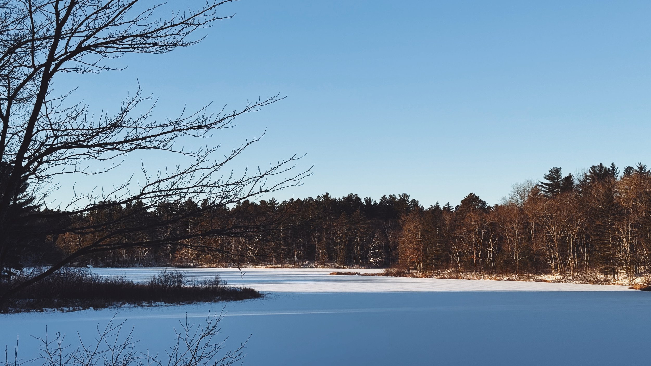 Snow-covered Vance Lake behind Dixie’s Coffee House on a cold winter morning.