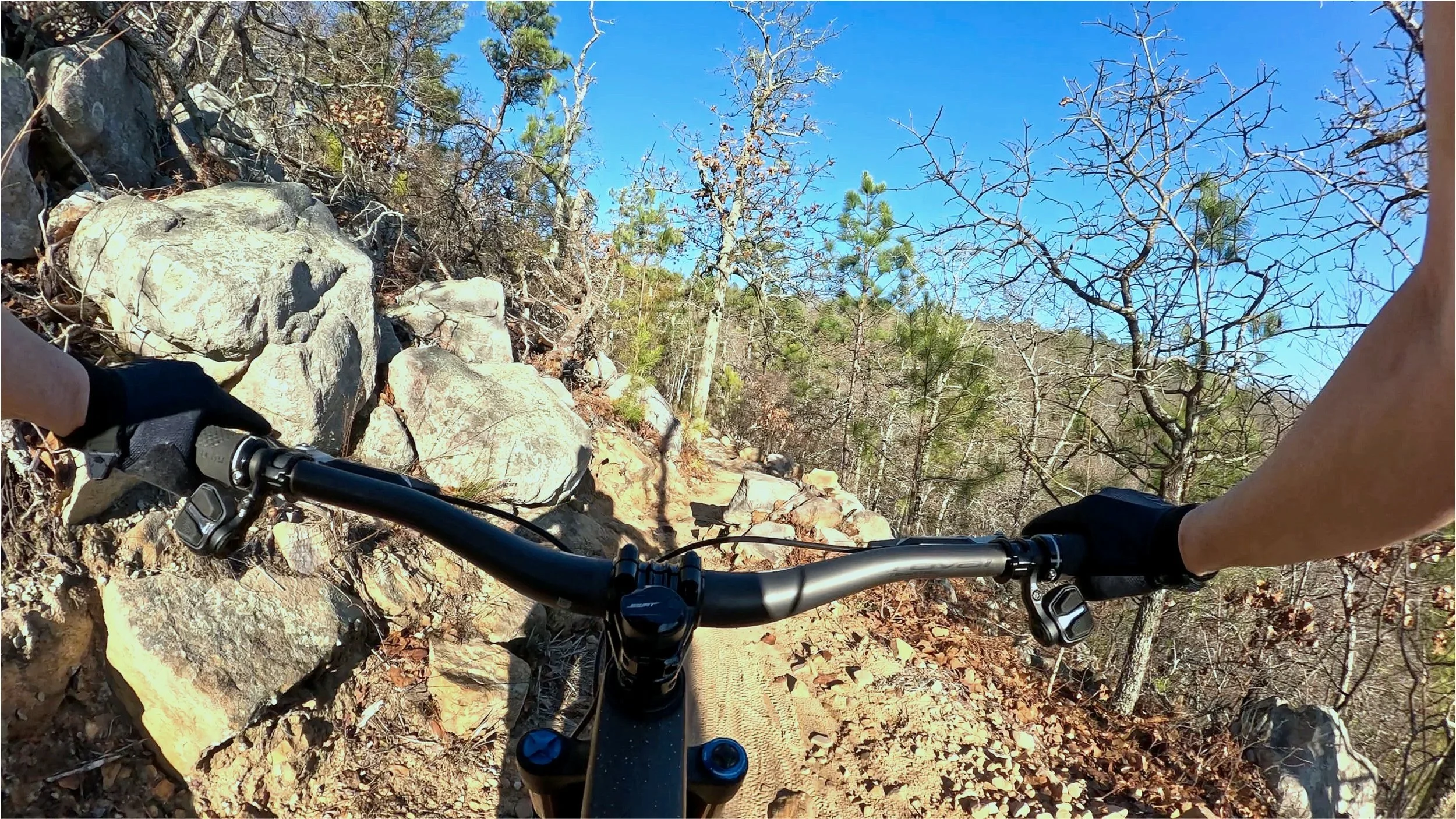 First-person view riding the rocky Talladega Trail, a blue-rated technical mountain bike trail at Coldwater Mountain in Anniston, Alabama.