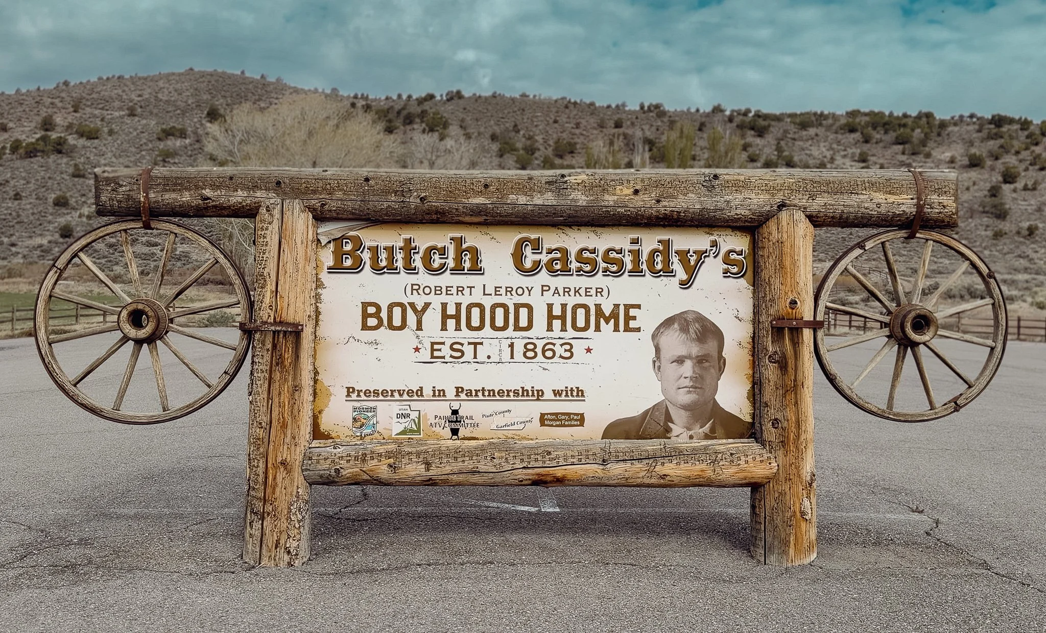 Butch Cassidy's Boyhood Home sign near Circleville, Utah, identifying Robert LeRoy Parker.