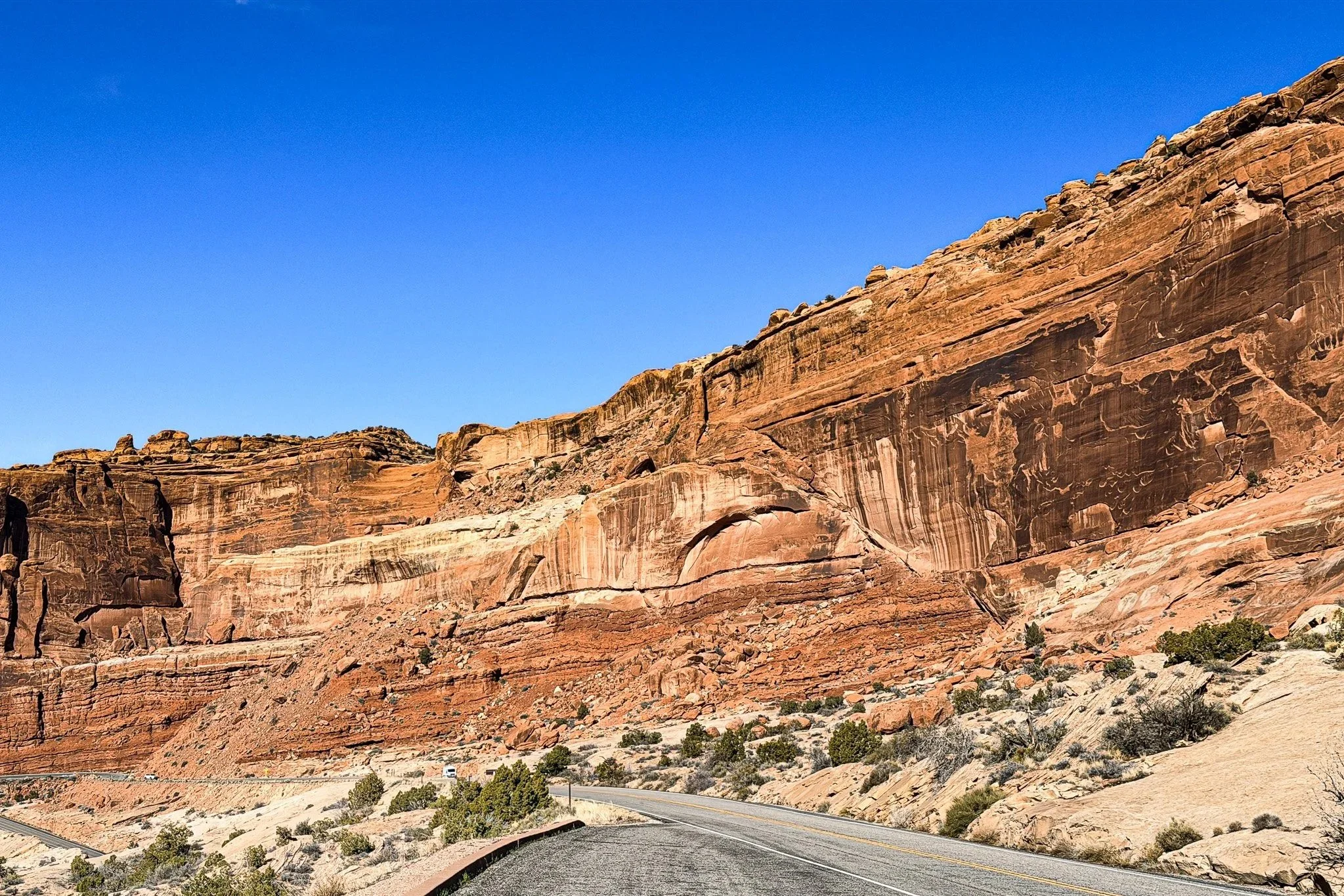 The Moab Fault exposed in red sandstone cliffs along the road inside Arches National Park near Moab, Utah.