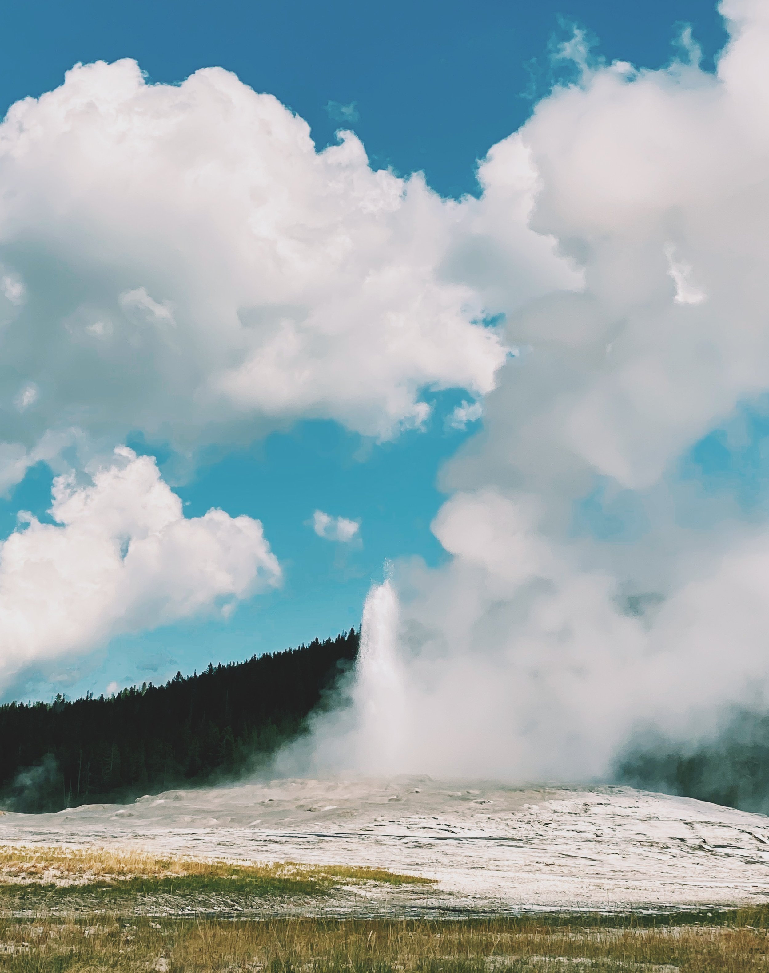 This is an image of the start of Old Faithful erupting. The geyser is located in Yellowstone National Park.