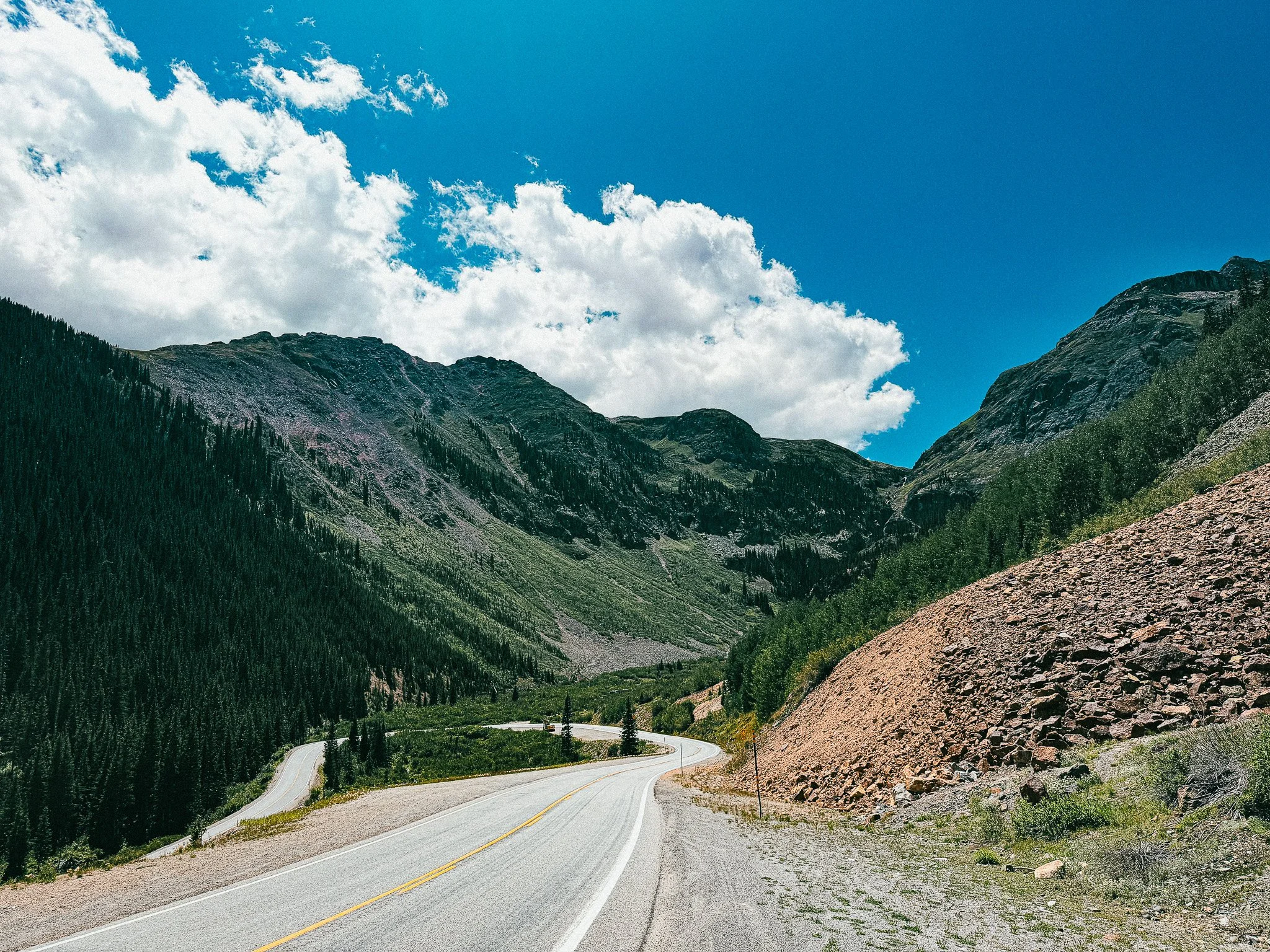 Million Dollar Highway winding through steep mountain terrain between Ouray and Silverton, Colorado.