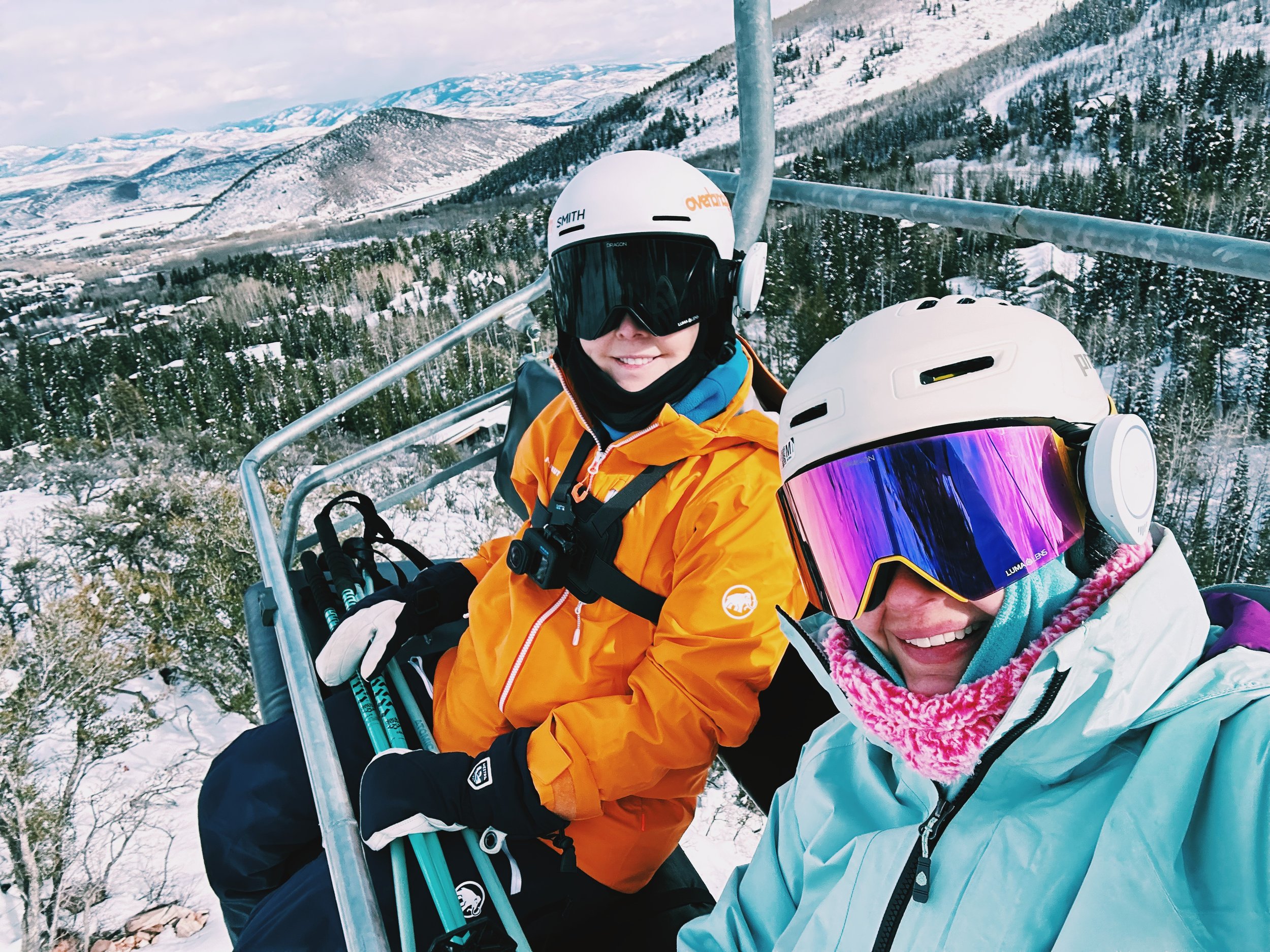 Kelly and I riding the Over and Out lift at Park City, surrounded by snowy mountain scenery.