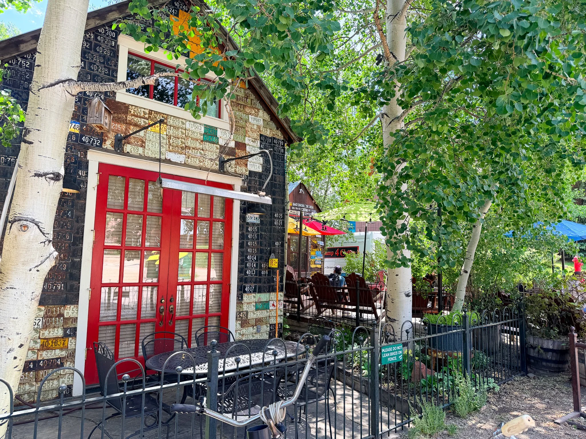 Camp 4 Coffee patio surrounded by aspen trees in downtown Crested Butte, Colorado.