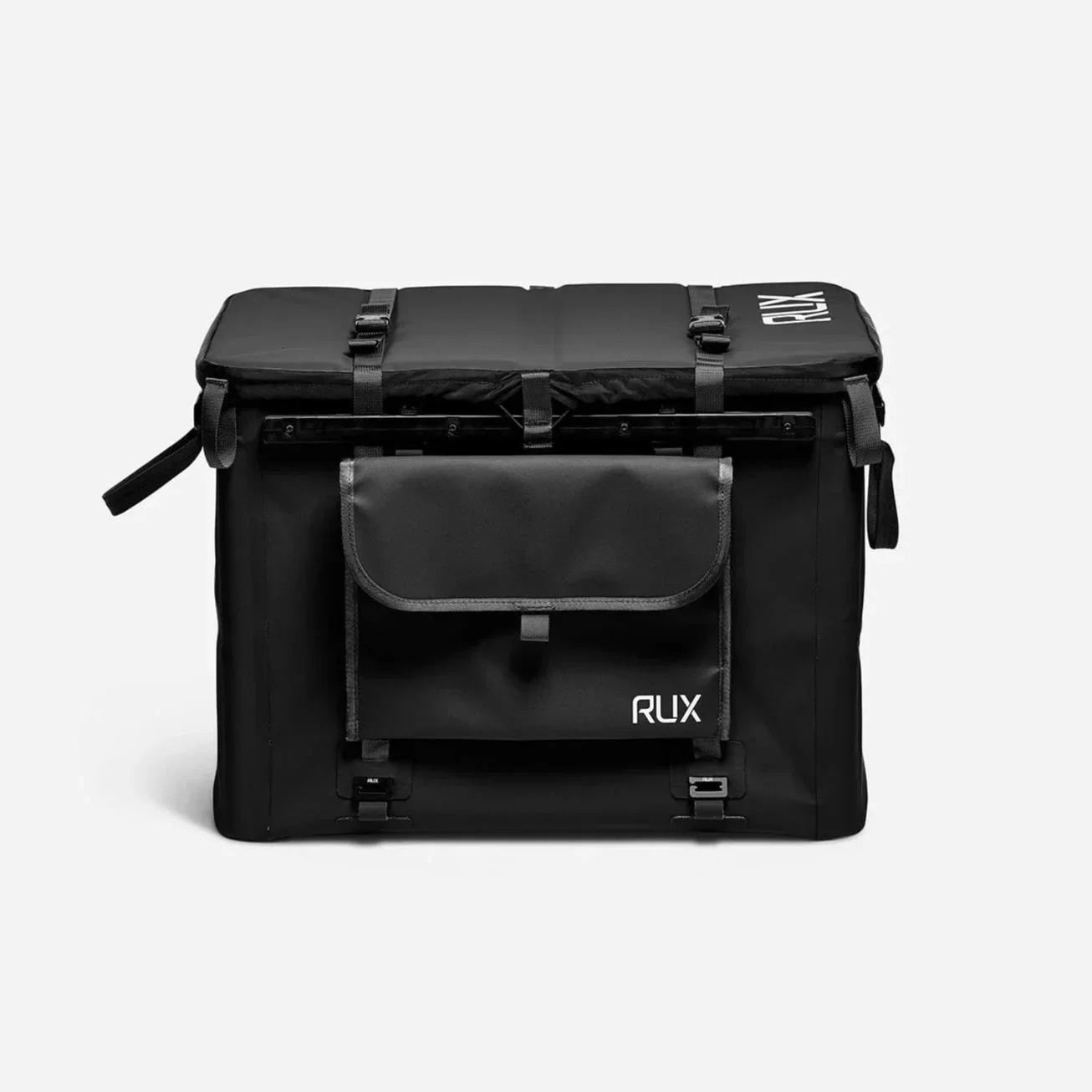 RUX Pocket attached to the outside of a black RUX 70L storage container.