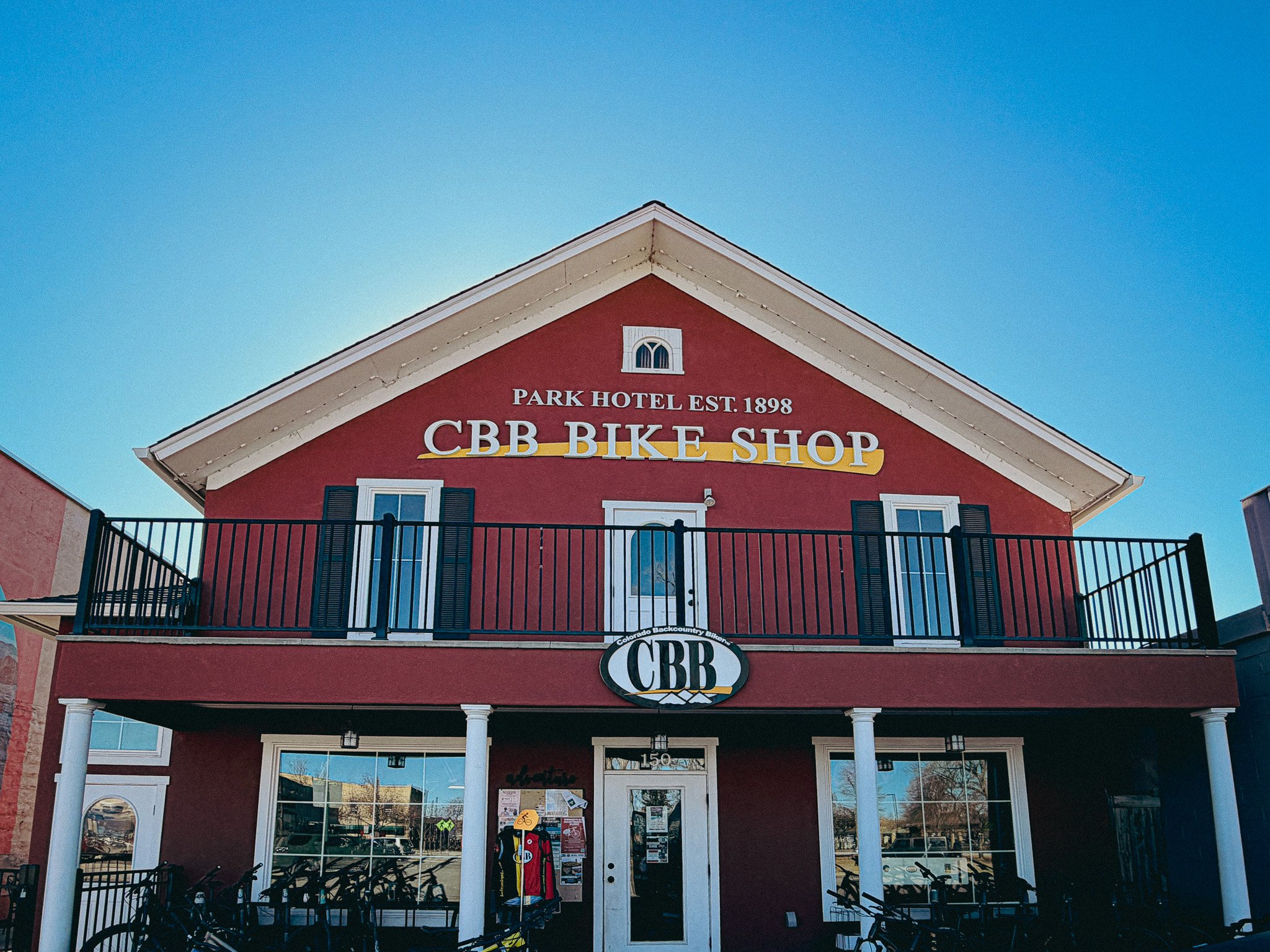 Front exterior of Colorado Backcountry Biker shop in Fruita, Colorado with bikes parked outside.