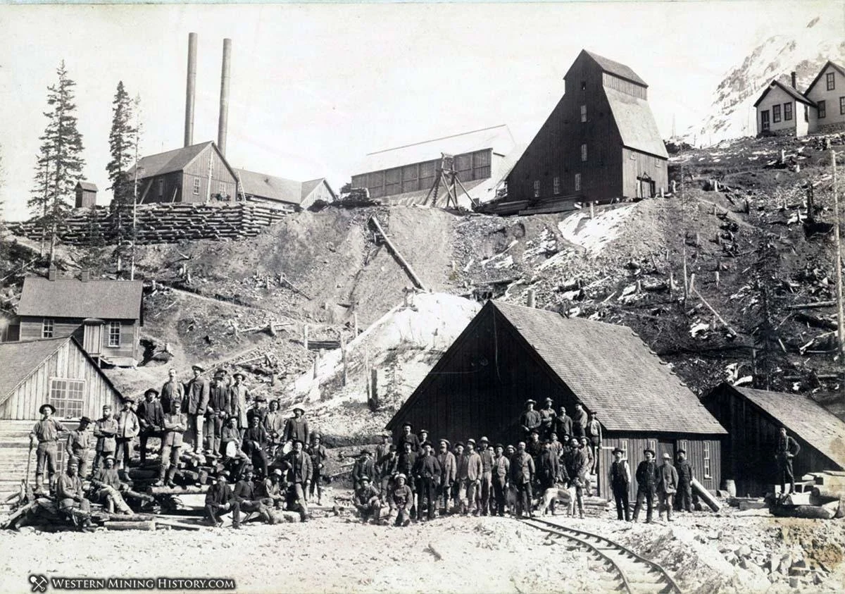 Historic photograph of miners and mine buildings in the Red Mountain Mining District of Colorado.