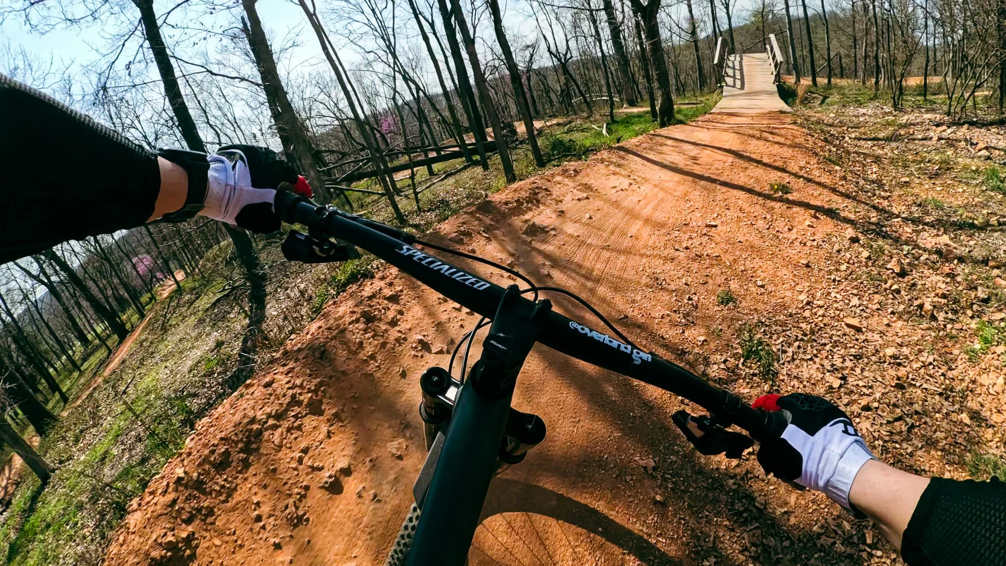 Rider’s point of view exiting the first berm on the Catapult trail at Slaughter Pen in Bentonville, Arkansas.