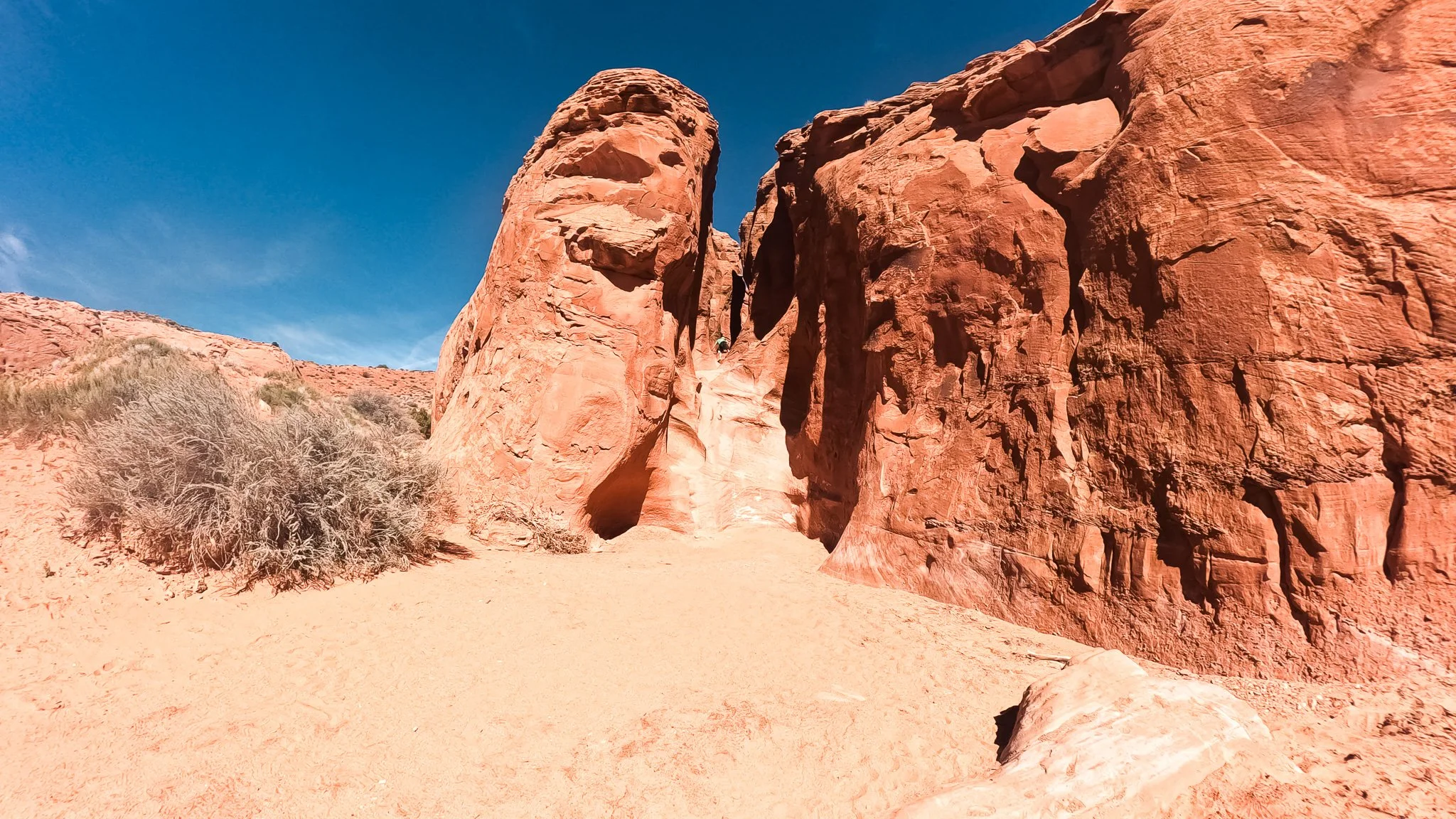 Entrance to Peek a Boo slot canyon showing steep sandstone walls in Grand Staircase Escalante National Monument