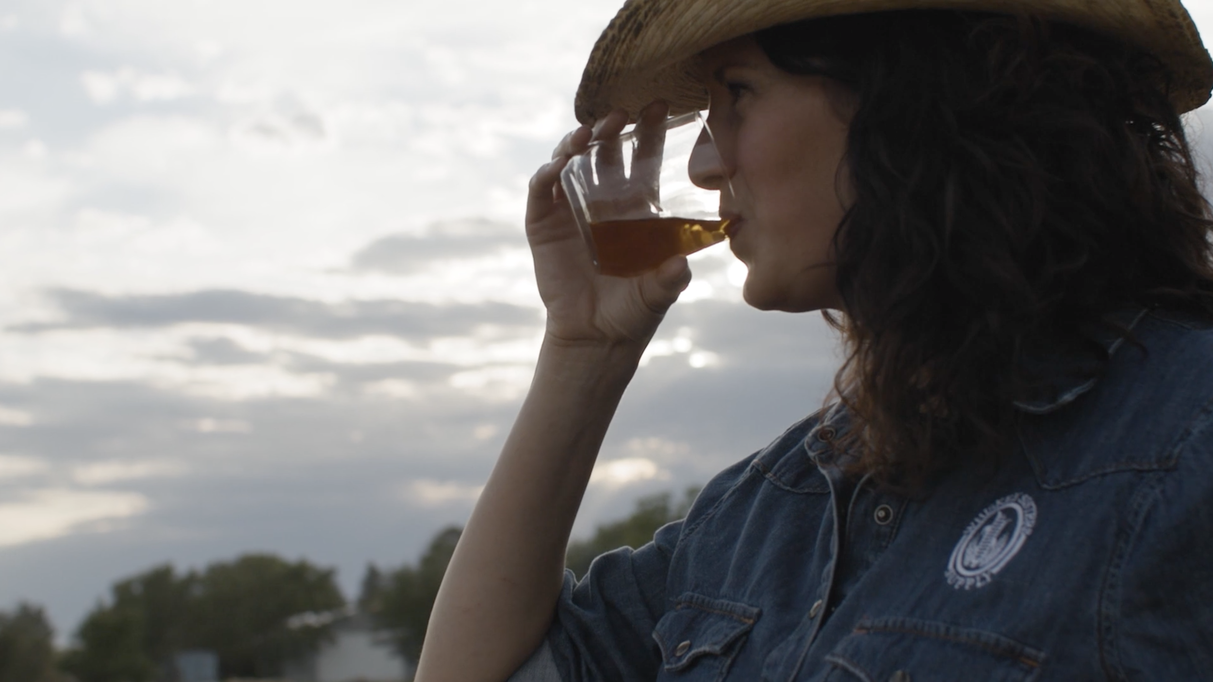 Felicia Ohnmacht sipping bourbon whiskey