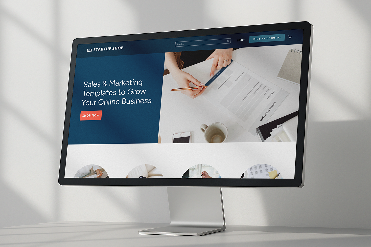 The top of the Startup Shop store home page displayed on a computer monitor. The store was built using Shopify.