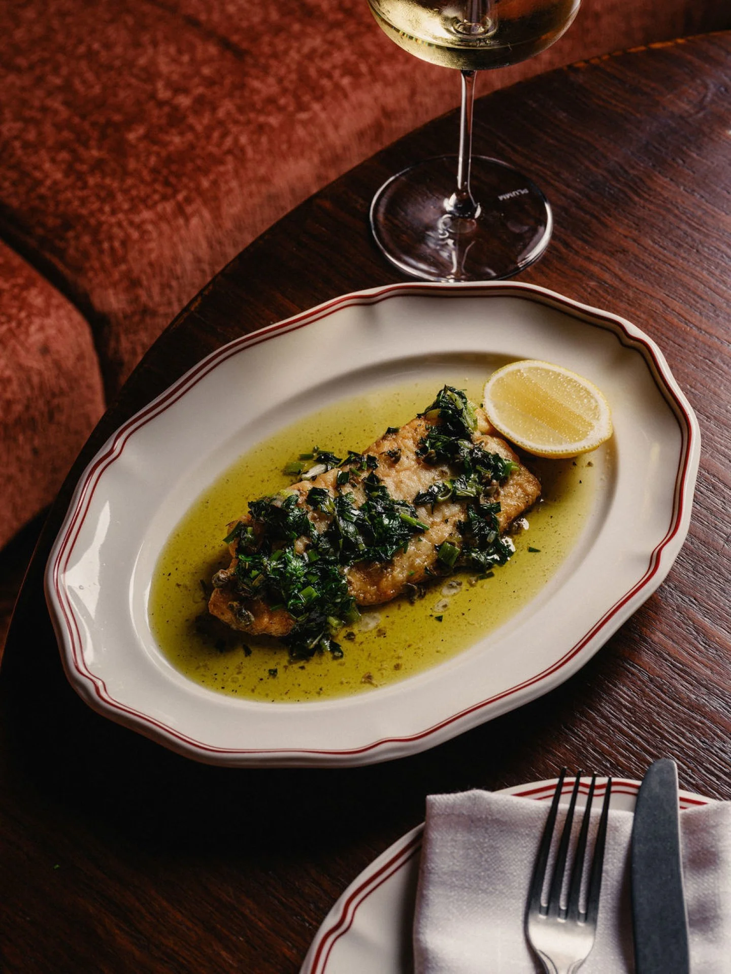 Our pink snapper piccata lifted with charred salsa verde and layered depth.