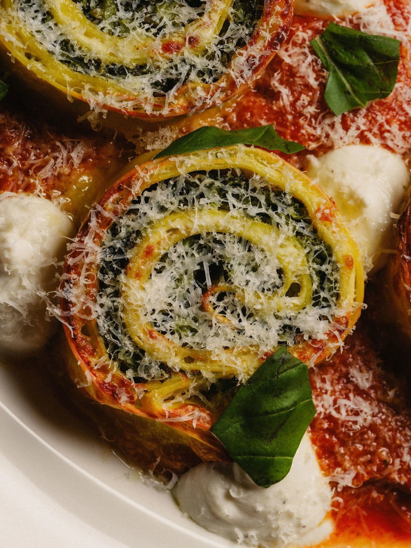 Rotolo on the table at Vitelli&rsquo;s Upstairs.

Summer greens and ricotta baked inside rolled pasta with pistachio pesto and red sauce. A classic style of rolled pasta often called swallow&rsquo;s nests.