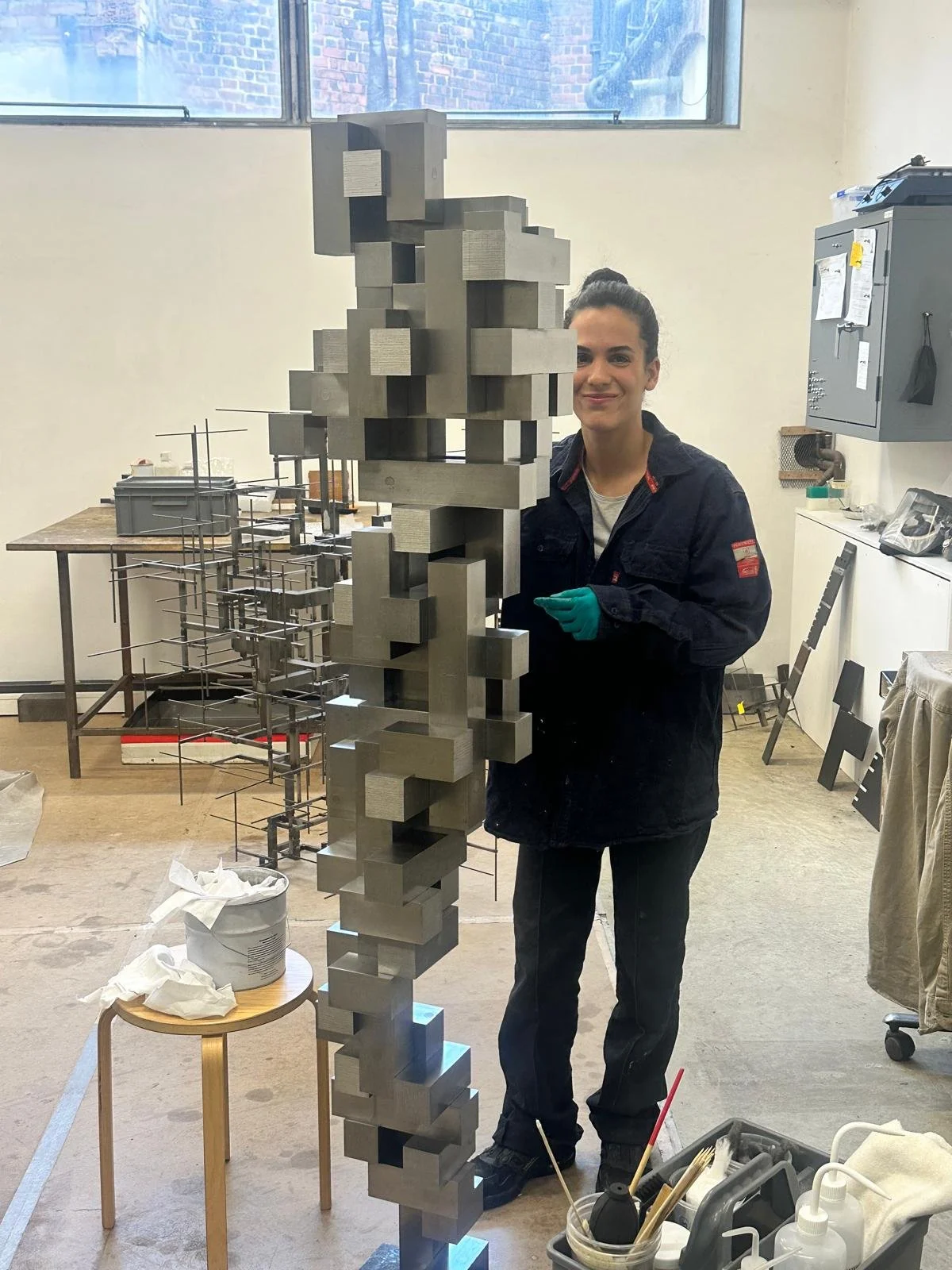 one of Gormley's elfs working on his sculpture