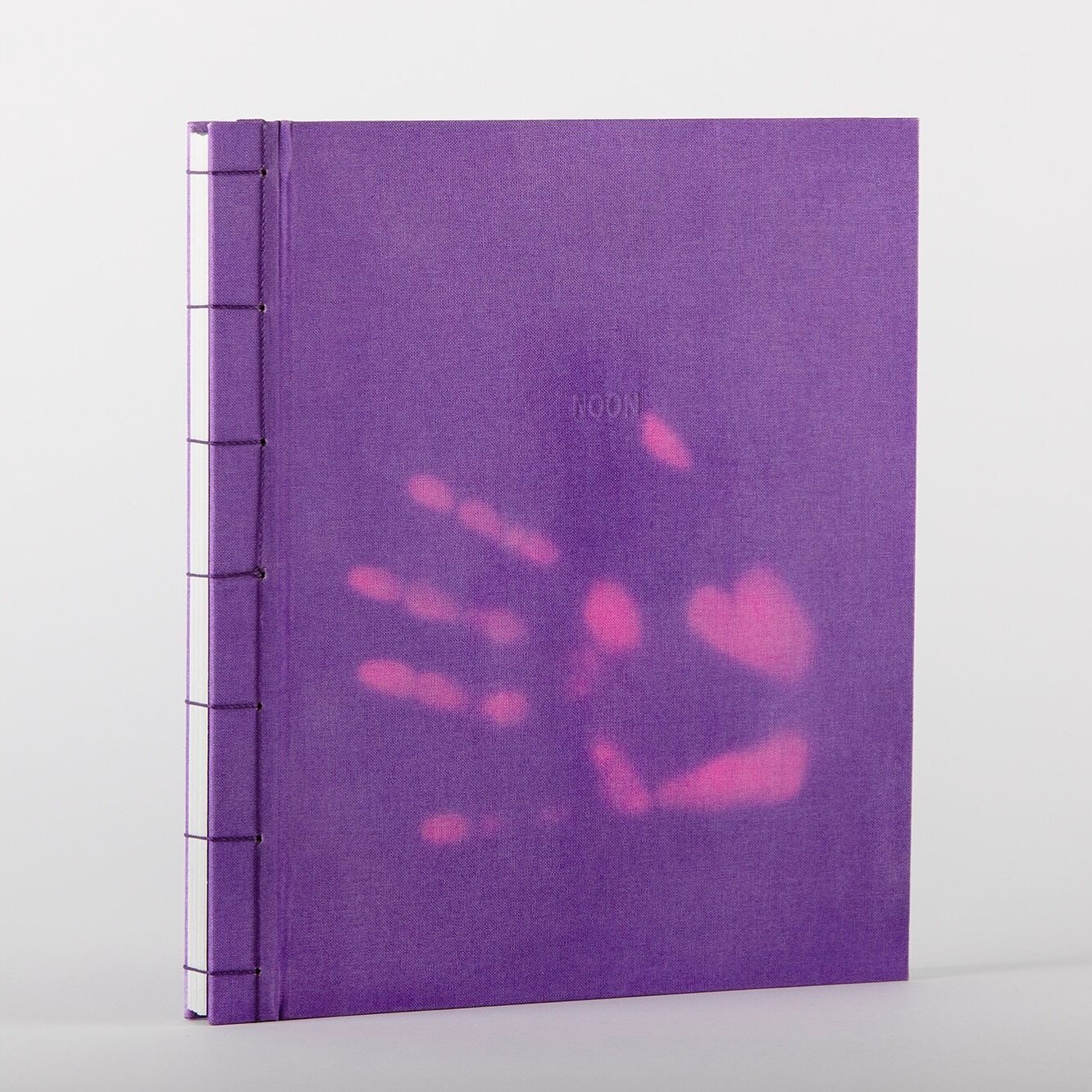 Noon by Laura Sperl

NOON is a visual and haptic experience of the passage of time and an invitation to be part of continuous change. The book consists of seven series of a mixture of photograms and chemigrams which resulted from experimentation with