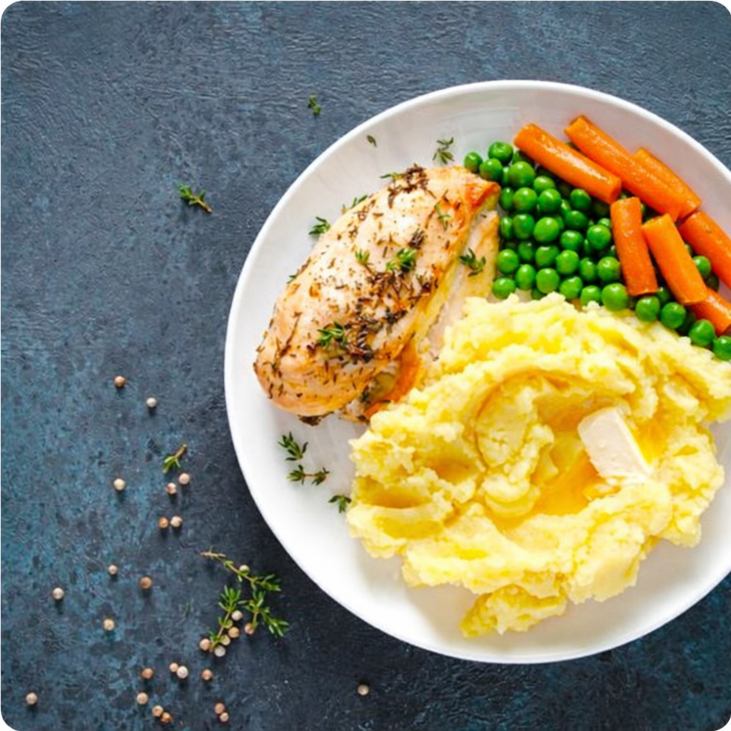 Herb chicken with mashed potatoes and veggies.png