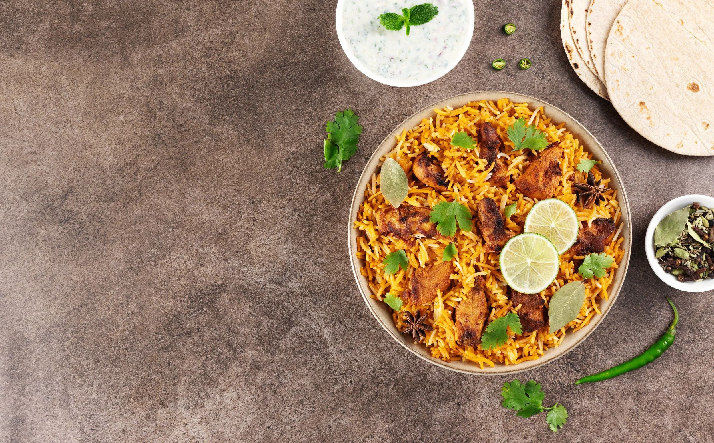 Chicken Masala Biryani With Mint, Coriander and Cumin  Yoghurt (on the side) GF