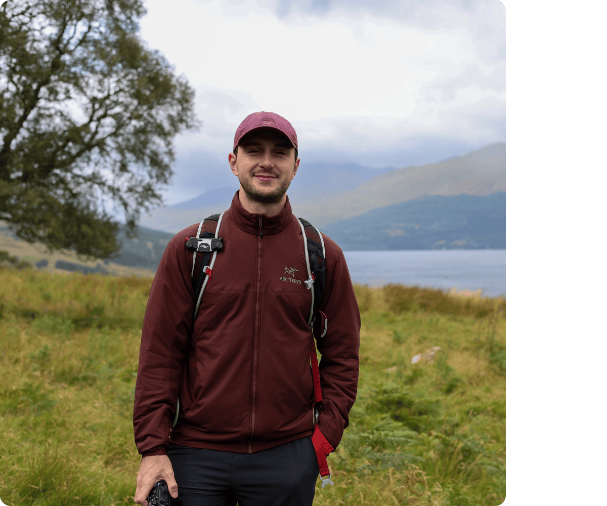 Roam with Ross in front of mountains