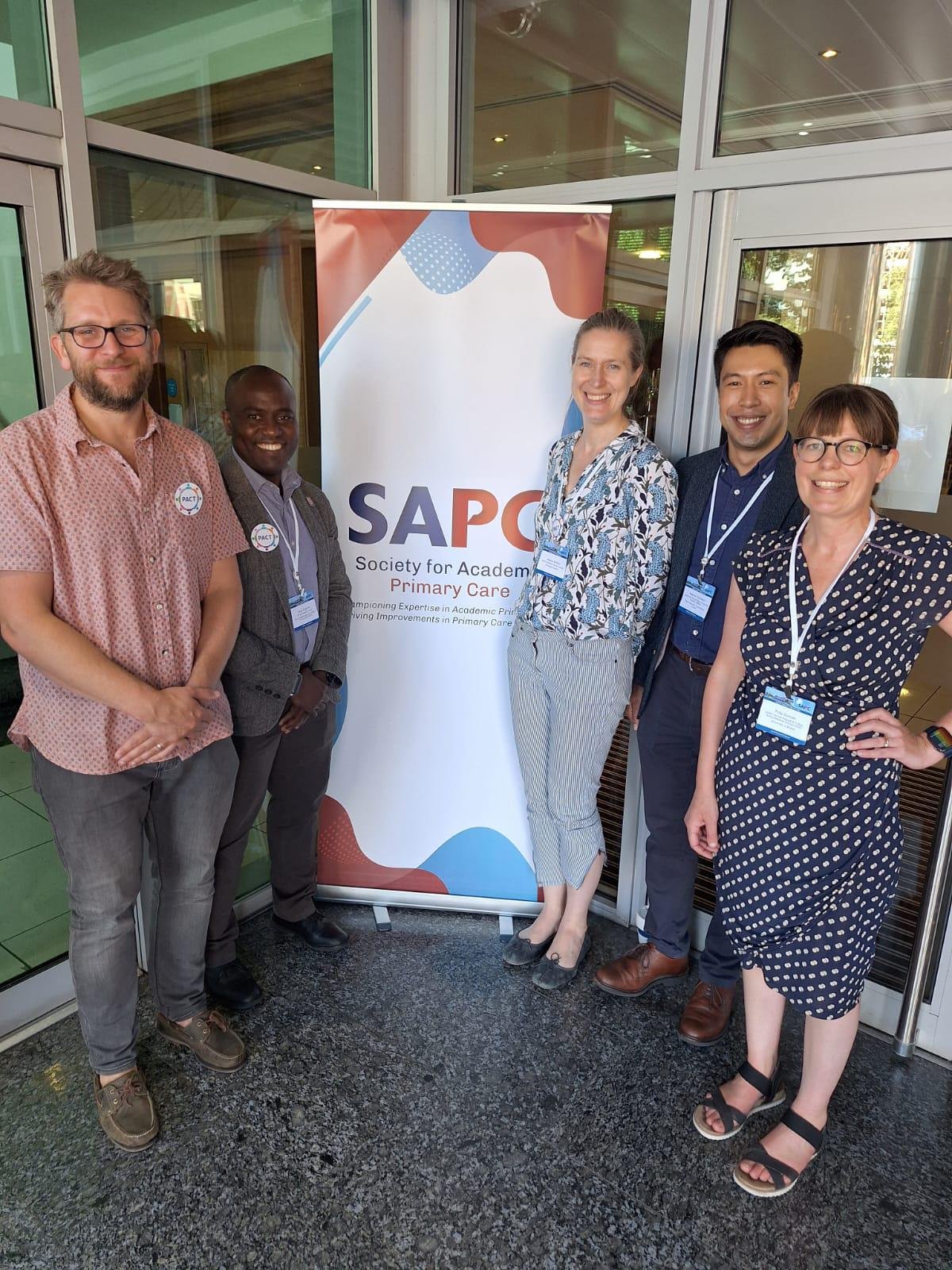 PACT team with SAPC banner.jpg