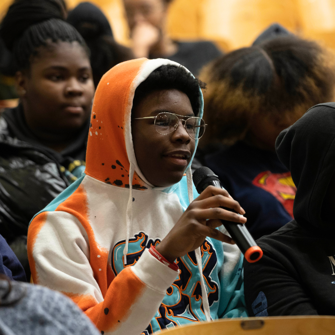Student talking on microphone