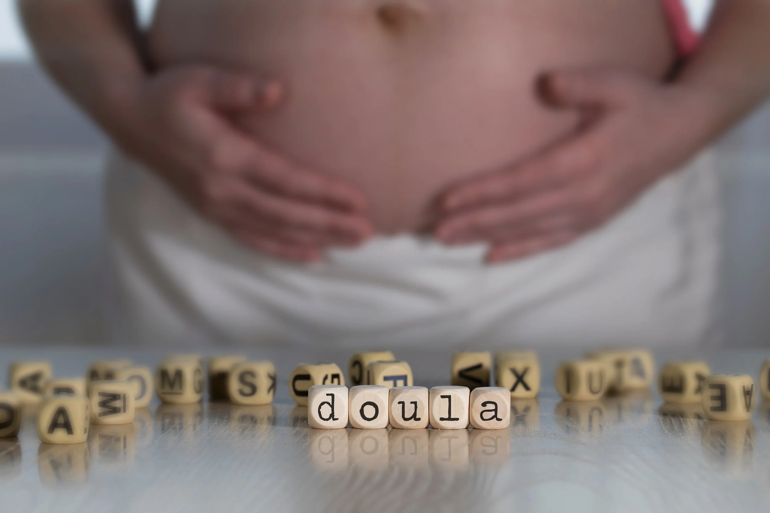 pregnant mother holding her stomach