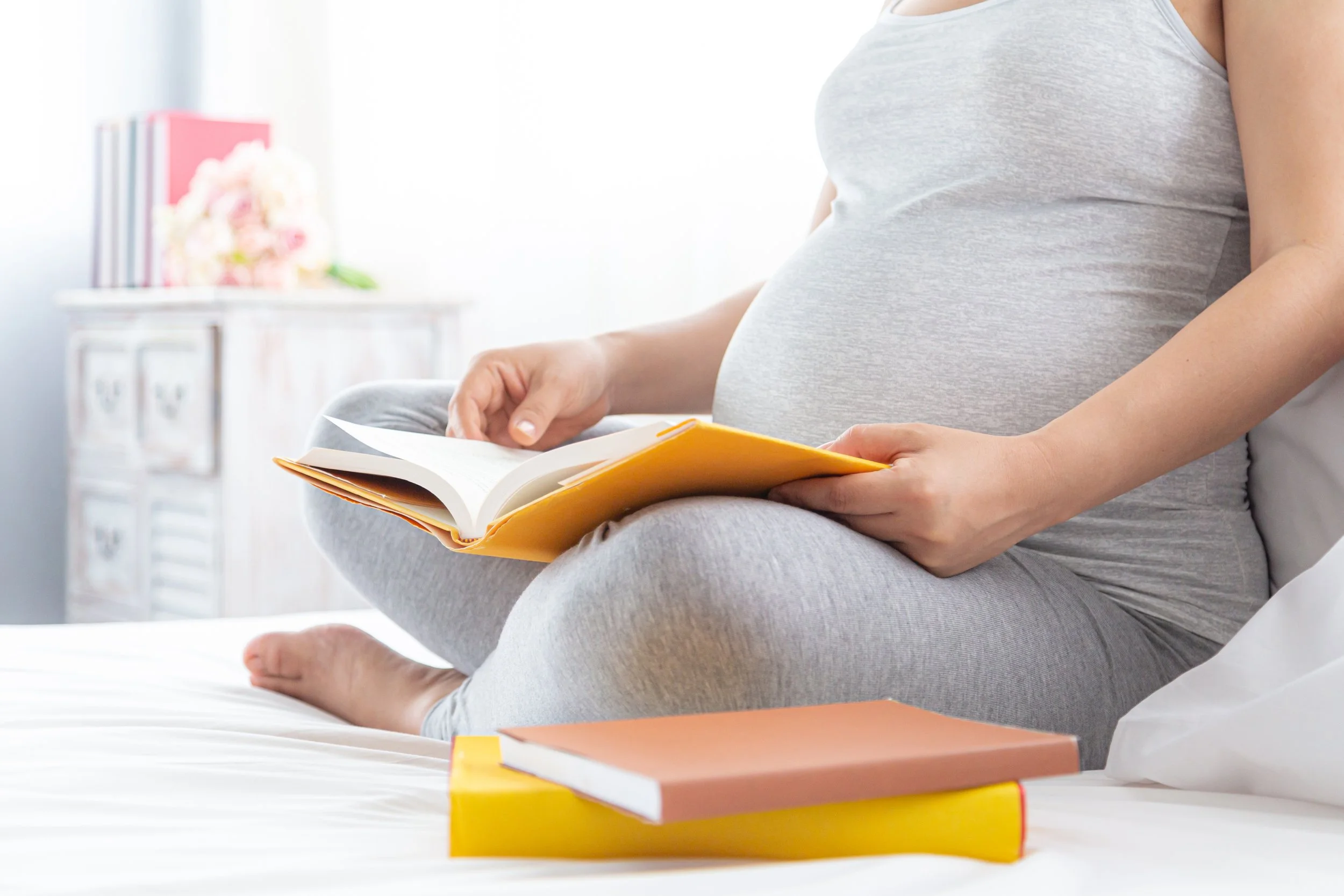 Pregnant mother reading a book