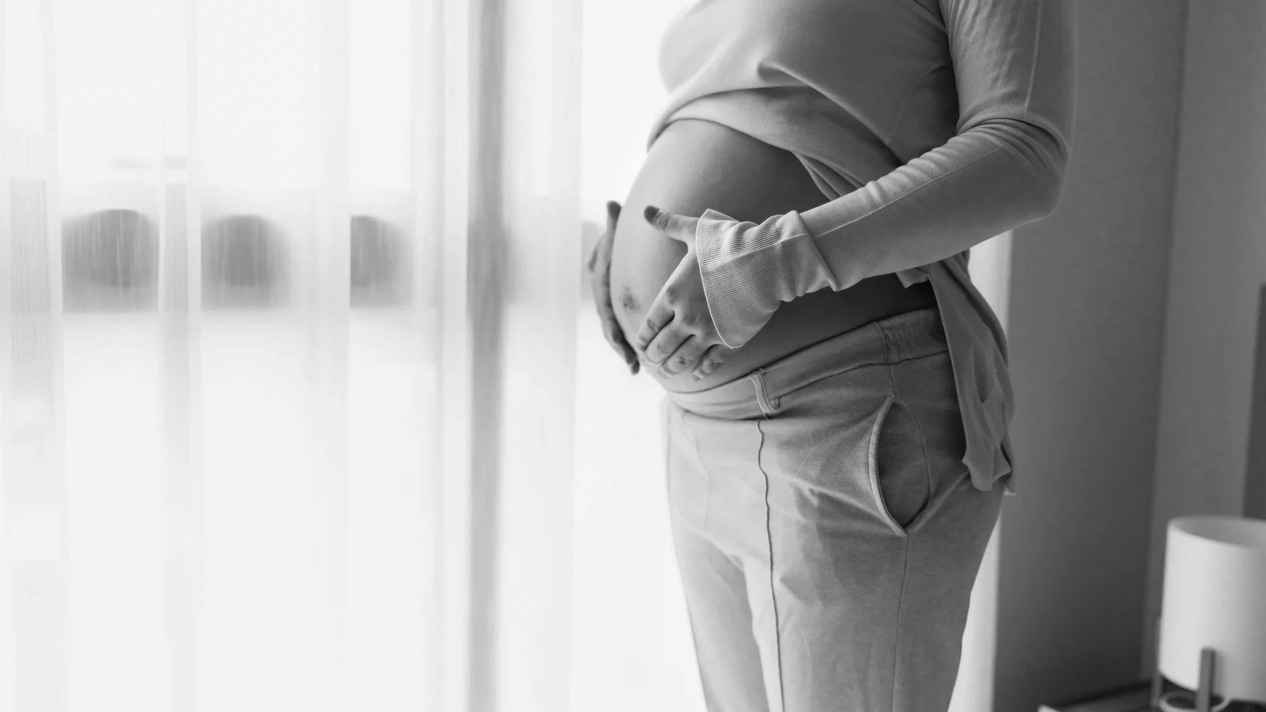 Pregnant individual receiving IV iron infusion in a safe, supervised Toronto clinic